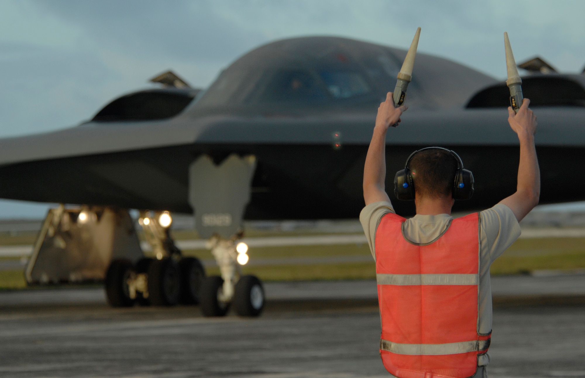 Staff Sgt.  Kyle Helton marshals in a B-2 Spirit at Andersen Air Force Base, Guam. More than 270 Airmen and four B-2 Spirits, 509th Bomb Wing, 13th Bomb Squadron Whiteman Air Force Base, Mo., will maintain the Pacific regions Continuous Bomber Presence. 

(U.S. Air Force photo/ Master Sgt. Kevin J. Gruenwald) released