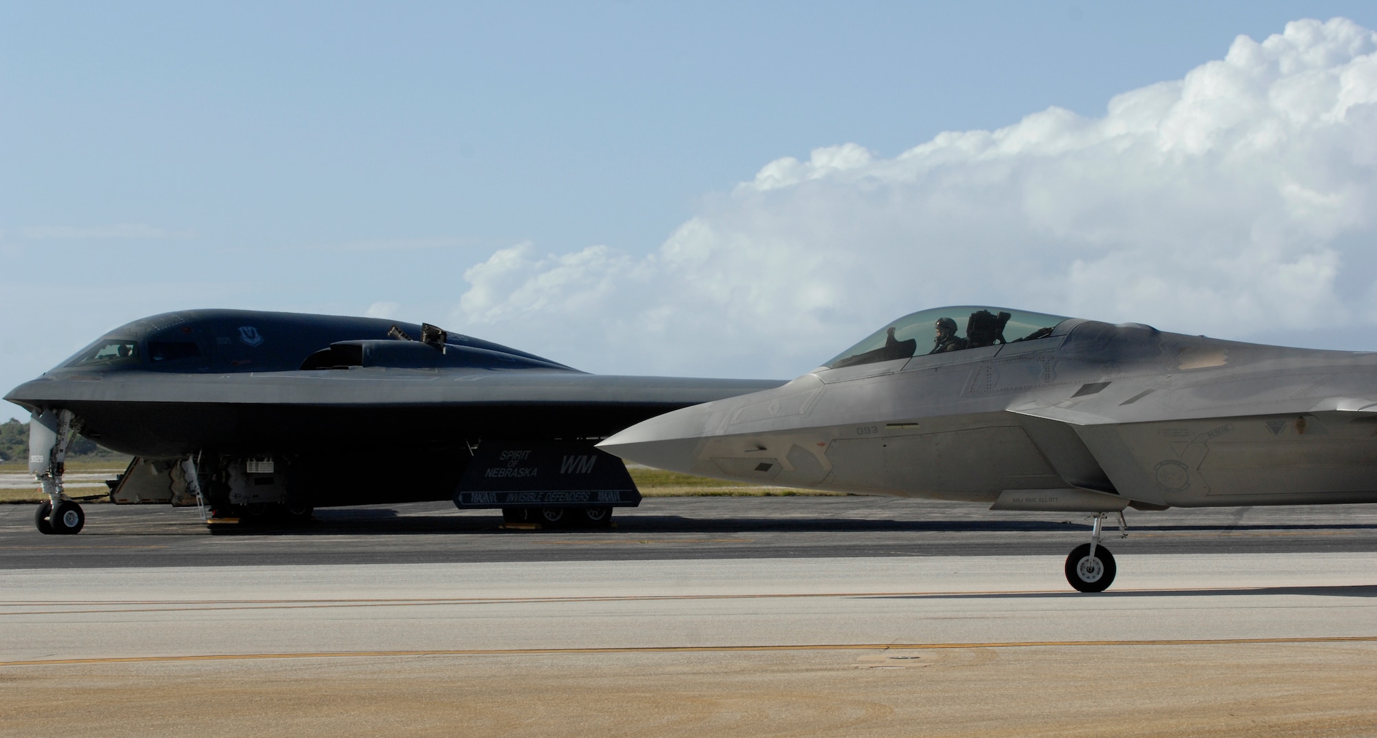An F-22 Raptor taxis at Andersen Air Force Base, Guam while a B-2 Spirit from the 509th Bomb Wing, 13th Bomb Squadron Whiteman Air Force Base, Mo., waits for clearance March 12.  The Raptors are deployed from Elmendorf Air Force Base, Alaska to the 90th Expeditionary Fighter Squadron at Andersen for a three month deployment as the Pacific's Theater Security Package. The stealth-fighters, along with associated maintenance and support personnel will participate in various exercises that provide routine training in an environment different from their home station. 

(U.S. Air Force photo/ Master Sgt. Kevin J. Gruenwald) released


























  












 











































  












 

























