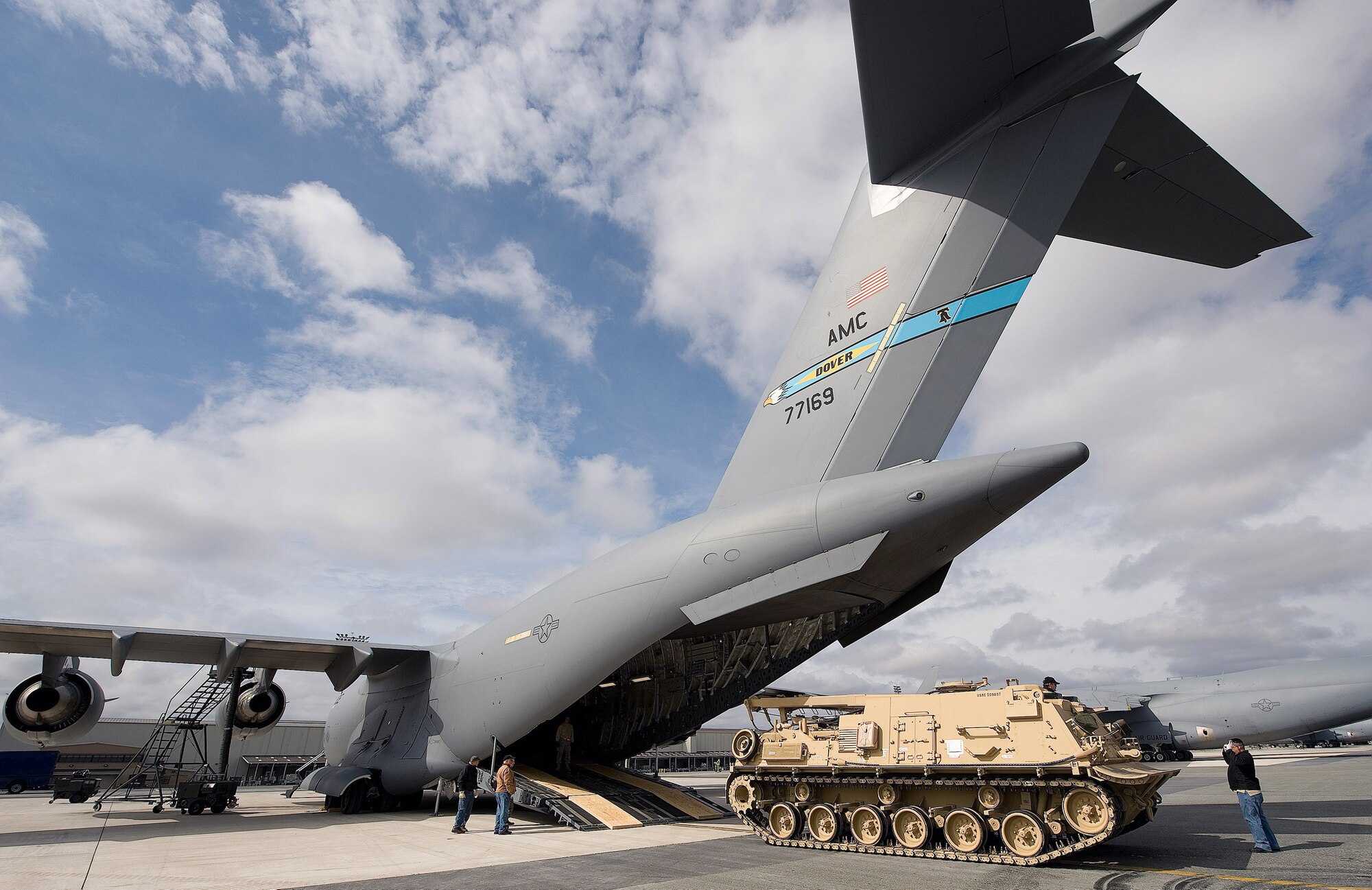 At Dover Air Force Base, Del., workers direct a U.S. Army M88A2 Heavy Equipment Recovery Combat Utility Lift and Evacuation System, or HERCULES, onto a C-17 Globemaster III.  The HERCULES recovers inoperative tanks, and provides protection against small arms fire. (U.S. Air Force photo/Jason Minto)