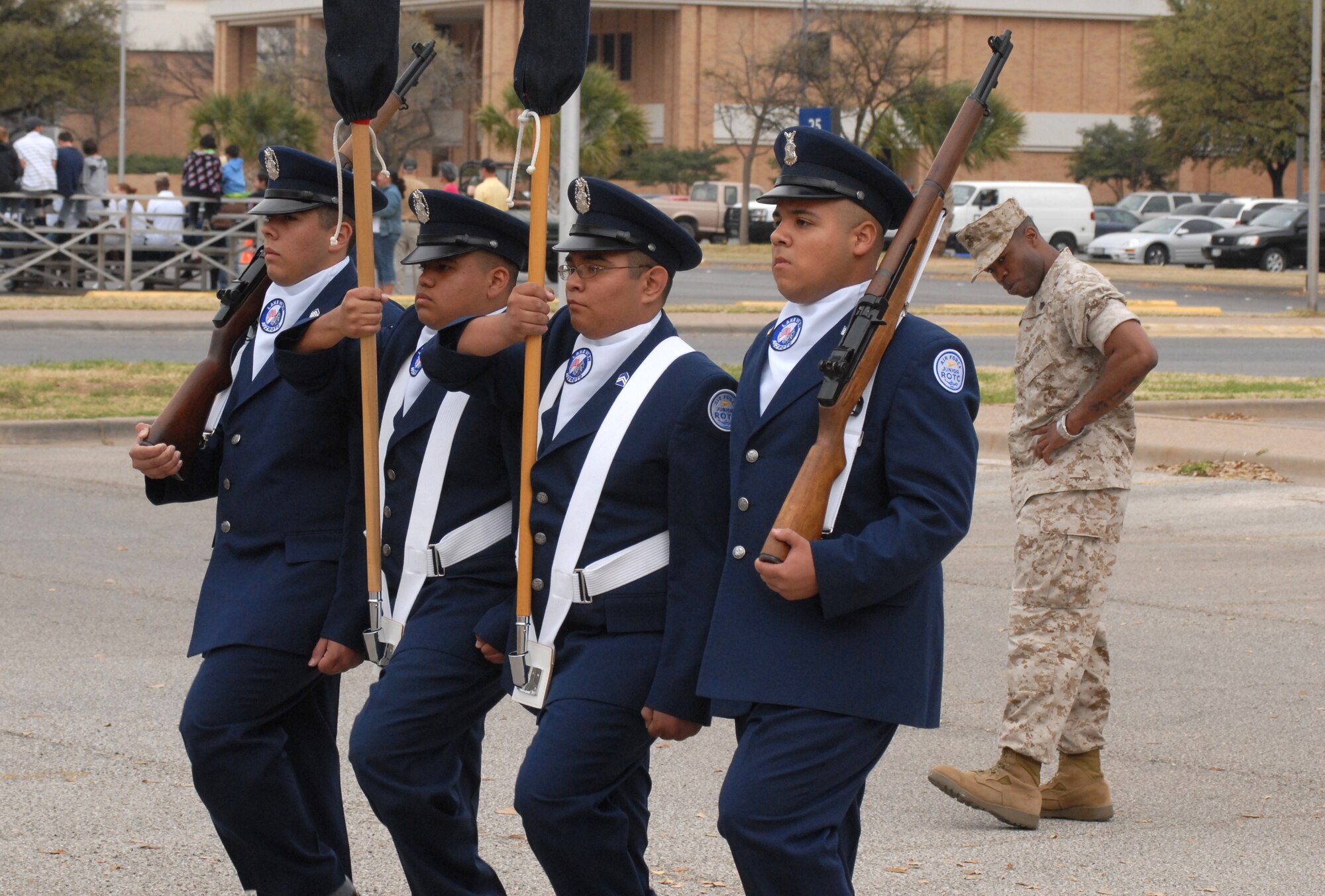 Air Force Junior Reserve Officer Training Corps color guard team from Lakeview High School, San Angelo, Texas are inspected by Sgt. Clifford Vinson, a Marine from Goodfellow Air Force Base.  Angelo State University held its annual Texas high school JROTC drill competition on March 7.  The event was hosted by the ASU Air Force ROTC Det 847.  About 125 junior JROTC students from 11 West Texas high schools, making up over 60 teams competed in armed and unarmed regulation, exhibition and inspection drills, individual drills, tandem drills, color guard and physical fitness event called the Warrior Challenge.  Judges included ASU AFROTC cadets and Army, Marine Corps and Navy personnel from Goodfellow Air Force Base. (U.S. Air Force photo by Senior Master Sgt. Robert Martinez)