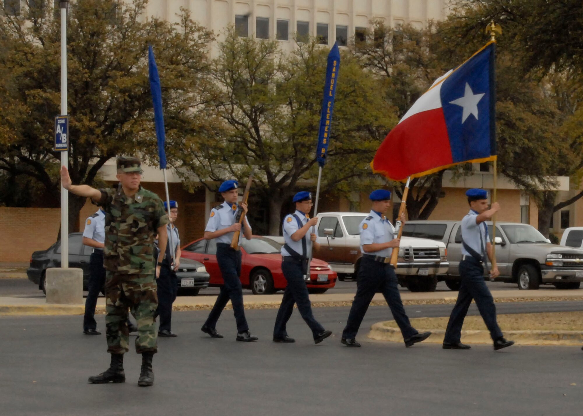 Air Force Junior Reserve Officer Training Corps cadets from Samuel Clemens High School, Schertz, Texas march towards the color guard drill competition area.  Angelo State University held its annual Texas high school JROTC drill competition, March 7. The event was hosted by the ASU Air Force ROTC Det 847. About 125 junior JROTC students from 11 West Texas high schools, making up over 60 teams competed in armed and unarmed regulation, exhibition and inspection drills, individual drills, tandem drills, color guard and a physical fitness event called the Warrior Challenge.  Judges included ASU AFROTC Cadets and Army, Marine Corp and Navy personnel from Goodfellow Air Force Base. (U.S. Air Force photo by Airman Clayton Lenhardt)