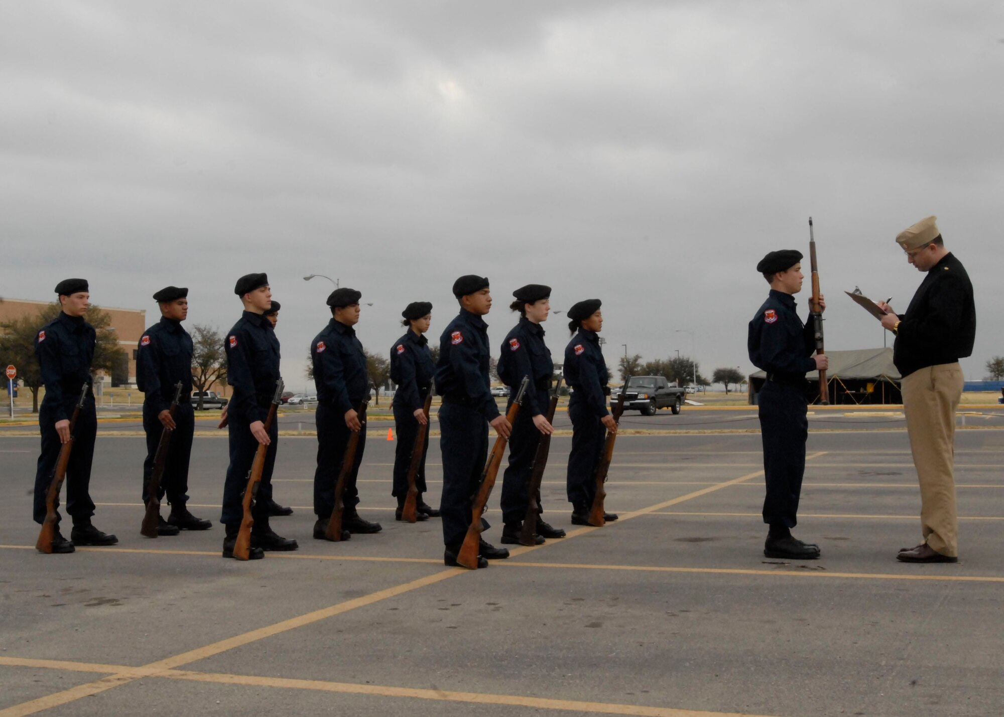 Air Force Junior Reserve Officer Training Corps cadets from Central High School, San Angelo, Texas get inspected for the armed regulation competition event.  Angelo State University held its annual Texas high school JROTC drill competition, March 7.  The event was hosted by the ASU Air Force ROTC Det 847. About 125 junior JROTC students from 11 West Texas high schools, making up over 60 teams competed in armed and unarmed regulation, exhibition and inspection drills, individual drills, tandem drills, color guard and a physical fitness event called the Warrior Challenge.  Judges included ASU AFROTC Cadets and Army, Marine Corp and Navy personnel from Goodfellow Air Force Base. (U.S. Air Force photo by Airman Clayton Lenhardt)