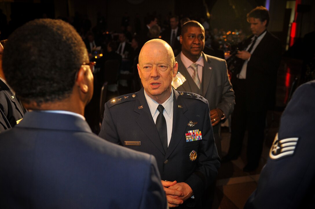 U.S. Air Force medical professionals from the 79th Medical Wing, meet Lt. Gen. (Dr.) James G. Roudebush, U.S. Air Force Surgeon General during a gala dinner in honor of military medics and corpsman at the Ronald Reagan Building in Washington, D.C., March 11, 2009.   (U.S. Air Force photo by Tech. Sgt. Suzanne M. Day)

