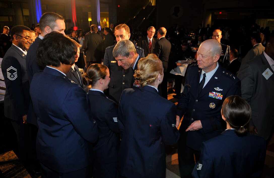 U.S. Air Force medical professionals from the 79th Medical Wing, meet U.S. Air Force Chief of Staff, Gen. Norton A. Schwartz, and Lt. Gen. (Dr.) James G. Roudebush, U.S. Air Force Surgeon General during a gala dinner in honor of military medics and corpsman at the Ronald Reagan Building in Washington, D.C., March 11, 2009.   (U.S. Air Force photo by Tech. Sgt. Suzanne M. Day)
