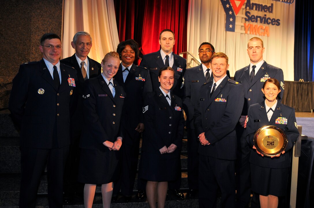 U.S. Air Force medical professionals from the 79th Medical Wing, stand for a photo with Craig W. Duehring, Assistant Secretary of the Air Force for Manpower and Reserve Affairs,
during a gala dinner in honor of military medics and corpsman at the Ronald Reagan Building in Washington, D.C., March 11, 2009.   (U.S. Air Force photo by Tech. Sgt. Suzanne M. Day)
