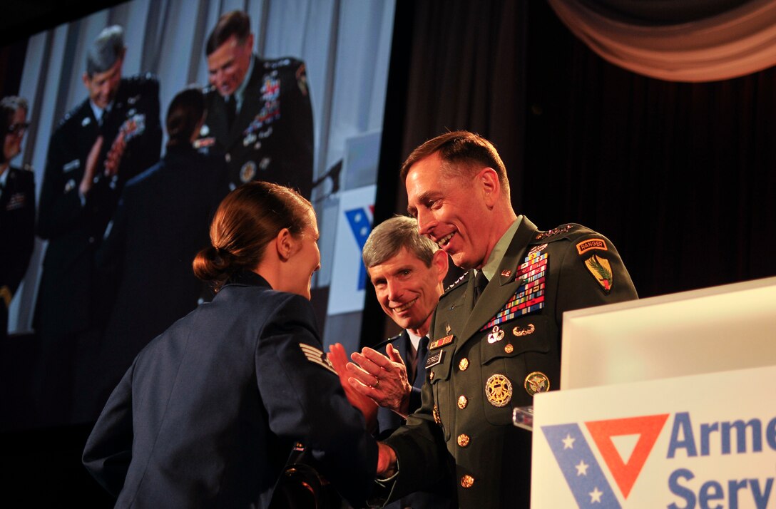 U.S. Air Force Staff Sgt. Stephanie Cates, Medical Technician, Urology Clinic, 779th Medical Group, is presented the Angels of the Battlefield Award by U.S. Army Gen. David Petraeus, Commander, U.S. Central Command, and U.S. Air Force Chief of Staff, Gen. Norton A. Schwartz, during a gala dinner in honor of military medics and corpsman at the Ronald Reagan Building in Washington, D.C., March 11, 2009.  Cates was nominated to receive the award on behalf of all U.S. Air Force Medics for her superior service and patient care during a recent deployment to Balad Air Base, Iraq.  (U.S. Air Force photo by Tech. Sgt. Suzanne M. Day)
