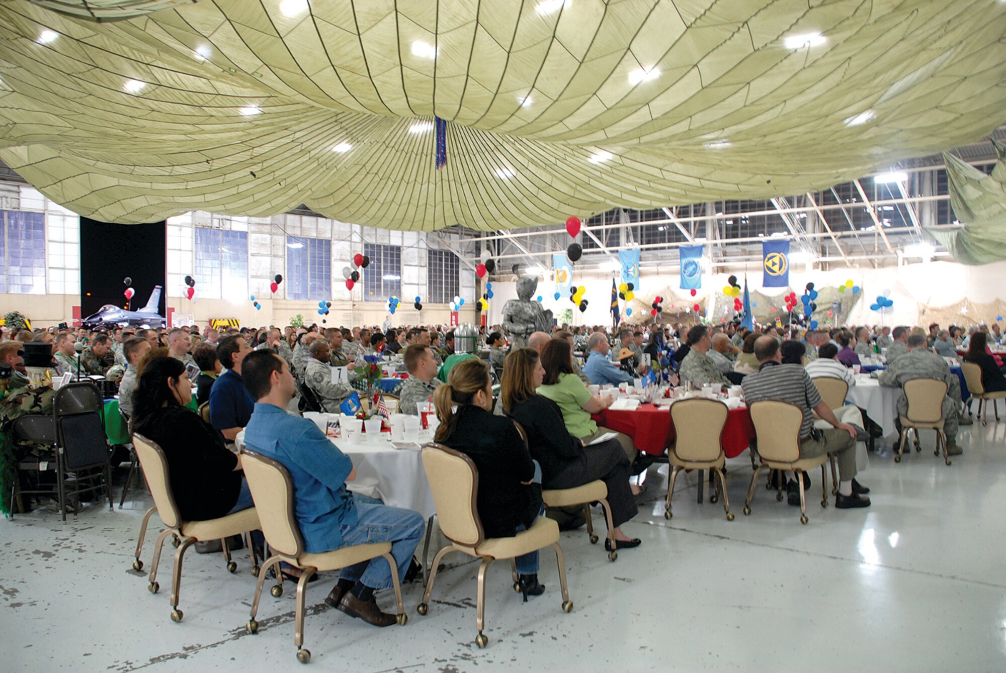 Members from the 56th Maintenance Group listen as Brig. Gen. Mark Atkinson, the commander of the 402nd Maintenance Wing, Warner Robins Air Logistics Center, Robins Air Force Base, Ga., speaks during the Maintenance Professional of the Year banquet. (U.S. Air Force photo/ Airman 1st Class Tracie Forte)