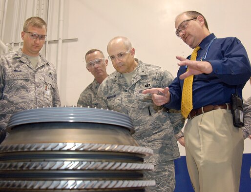 During his three-day visit to the Oklahoma Air Logistics Center, Brig. Gen. Kenneth Merchant, second from right, toured the F108 engine maintenance area and learned about the center’s current work and the challenges of core assembly modules, including the compressor. General Merchant, the Air Mobility Command director of Logistics was briefed by Thomas Leinneweber, 546th Propulsion Maintenance Squadron. Listening in are Col. Evan Miller, left, 76th PMXG commander and Col. Greg Steuer, the IMA to the OC-ALC commander.