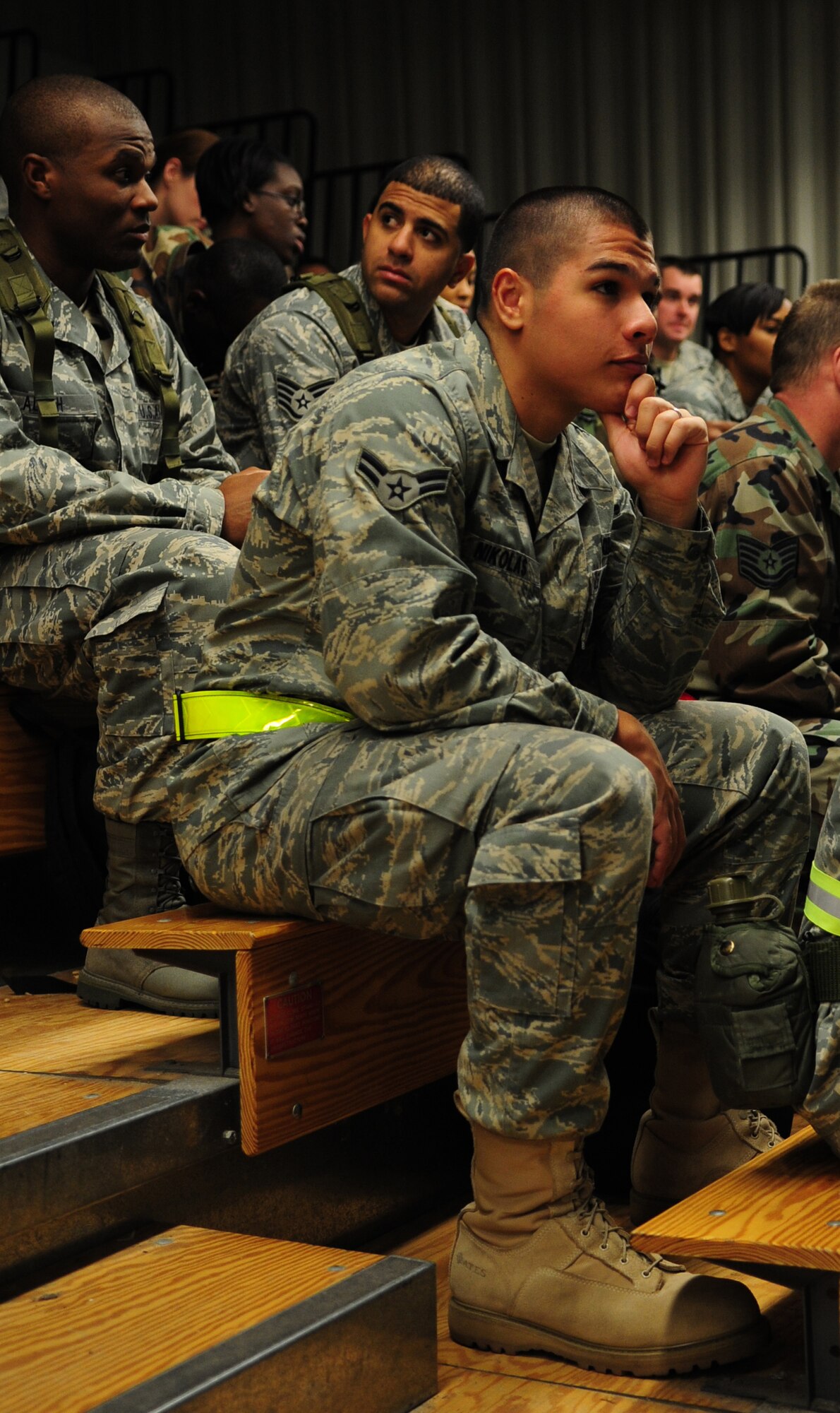 Airman 1st Class Mark Nikolas, 4th Communications Squadron, and other 4th Fighter Wing Airmen are briefed during a training exercise at Seymour Johnson Air Force Base, N.C., March 12, 2009. The operational readiness exercise prepares Airmen for the deployment process.  (U.S. Air Force photo by Airman 1st Class Rae A. Perry)