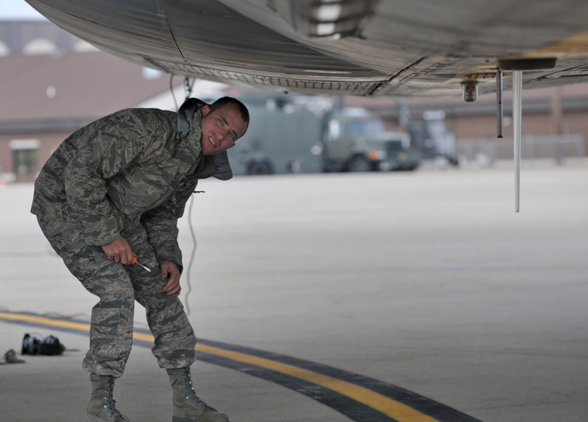 Senior Airman Allen Cooper inspects the bottom of a KC-135 Stratotanker during an aeromedical evacuation training mission he was part of in early March. Airman Cooper is a nondestructive inspection journeyman assigned to the 931st Aircraft Maintenance Squadron. (U.S. Air Force photo/Tech. Sgt. Jason Schaap)
