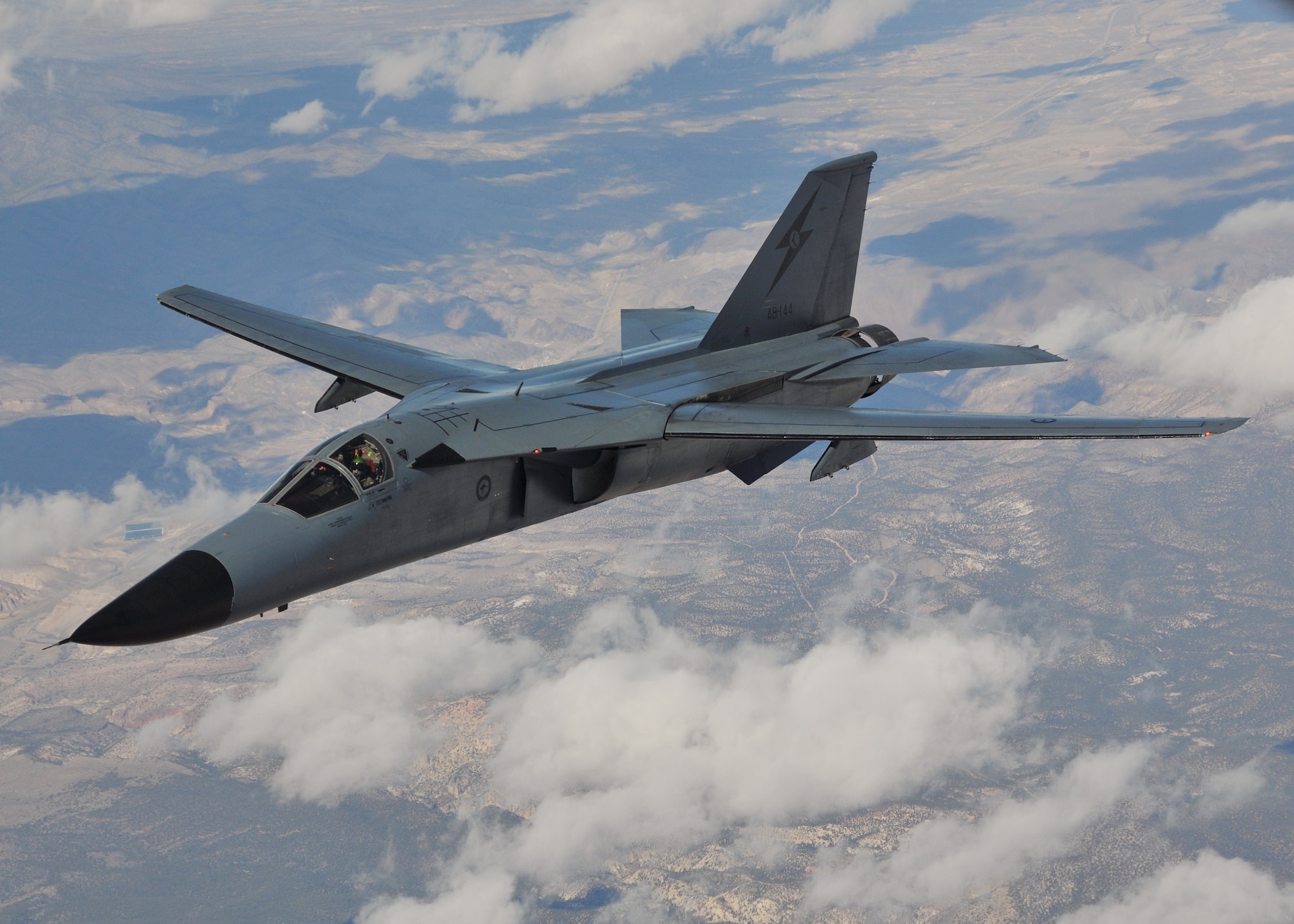 A Royal Australian Air Force F-111C flies over the Nevada Test and Training Range during a Red Flag 09-03 mission March 4.  The F-111Cs and their crews provided long-range strike capabilities for the exercise's "Blue" forces.  This will be the last Red Flag appearance for the Australian F-111s as the type is being retired in 2010.  Red Flag provides realistic combat training for U.S., allied and coalition air forces.  U.S. Air Force photo by Gary Emery  