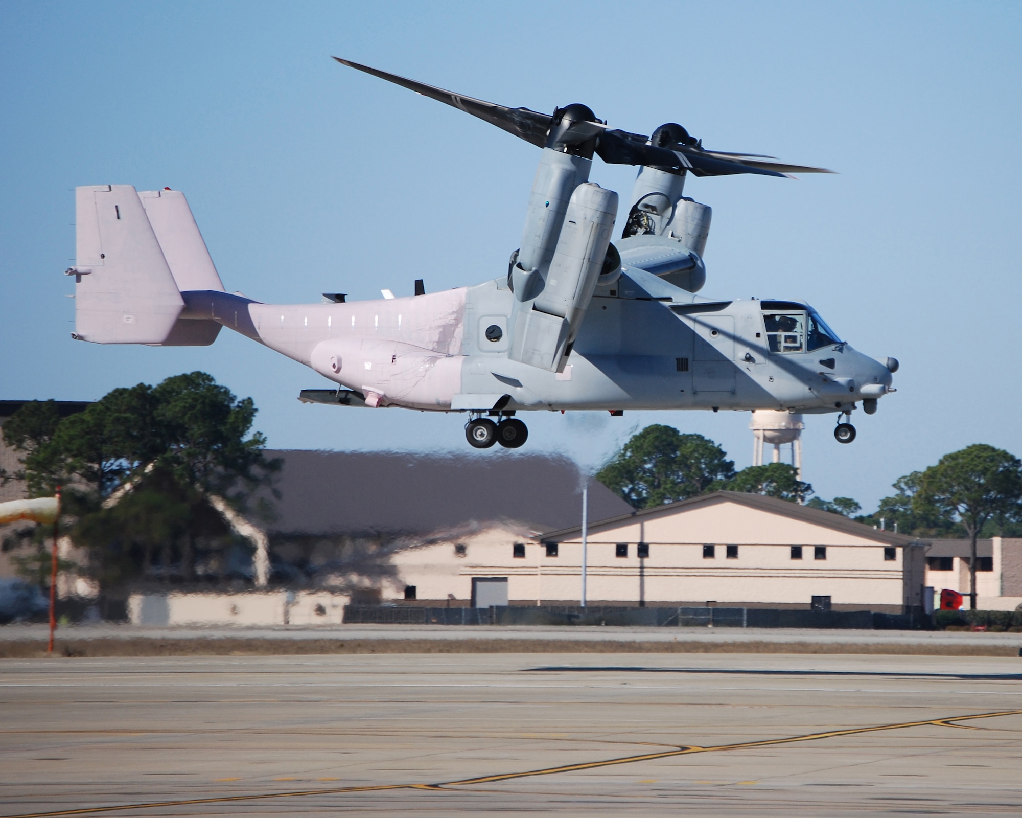 HURLBURT FIELD, Fla. - A CV-22 Osprey from the 413th Flight Test Squadron hovers over Hurlburt Field recently before flying a fuel jettison test mission. The back half of the helicopter is coated with a substance that turns bright red when it comes in contact with fuel. (U.S. Air Force photo/Thomas Cooper)