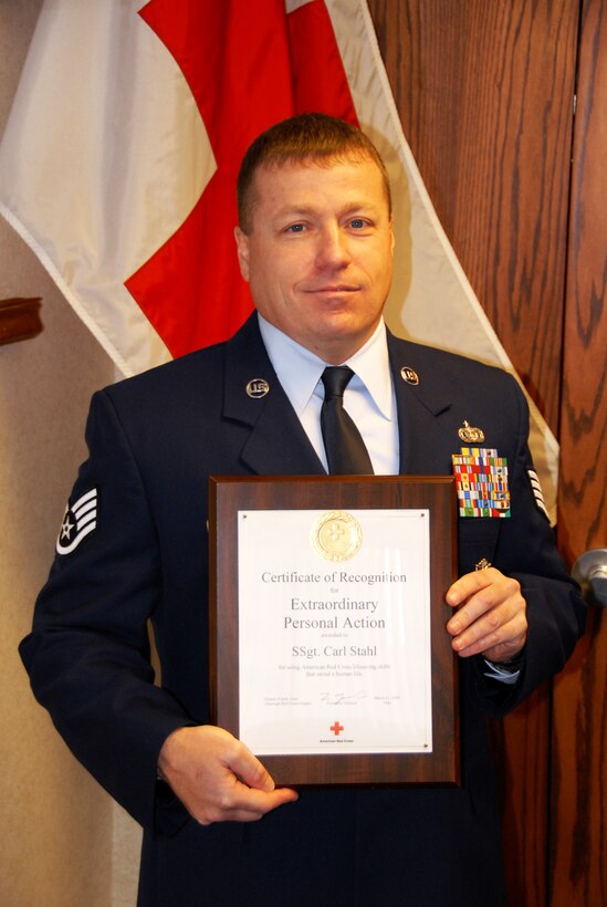 Staff Sgt. Carl Stahl, 180th Fighter Wing Security Forces, Ohio Air National Guard, was honored by the Greater Toledo Area American Red Cross Chapter March 11. Staff Sgt Stahl was presented with a Certificate of Recognition for Extraordinary Personal Action after he aided in stabilizing a seriously injured driver at the scene of a car accident until rescue crews arrived. USAF Photo by Master Sgt. Ed Wagner (Released). 