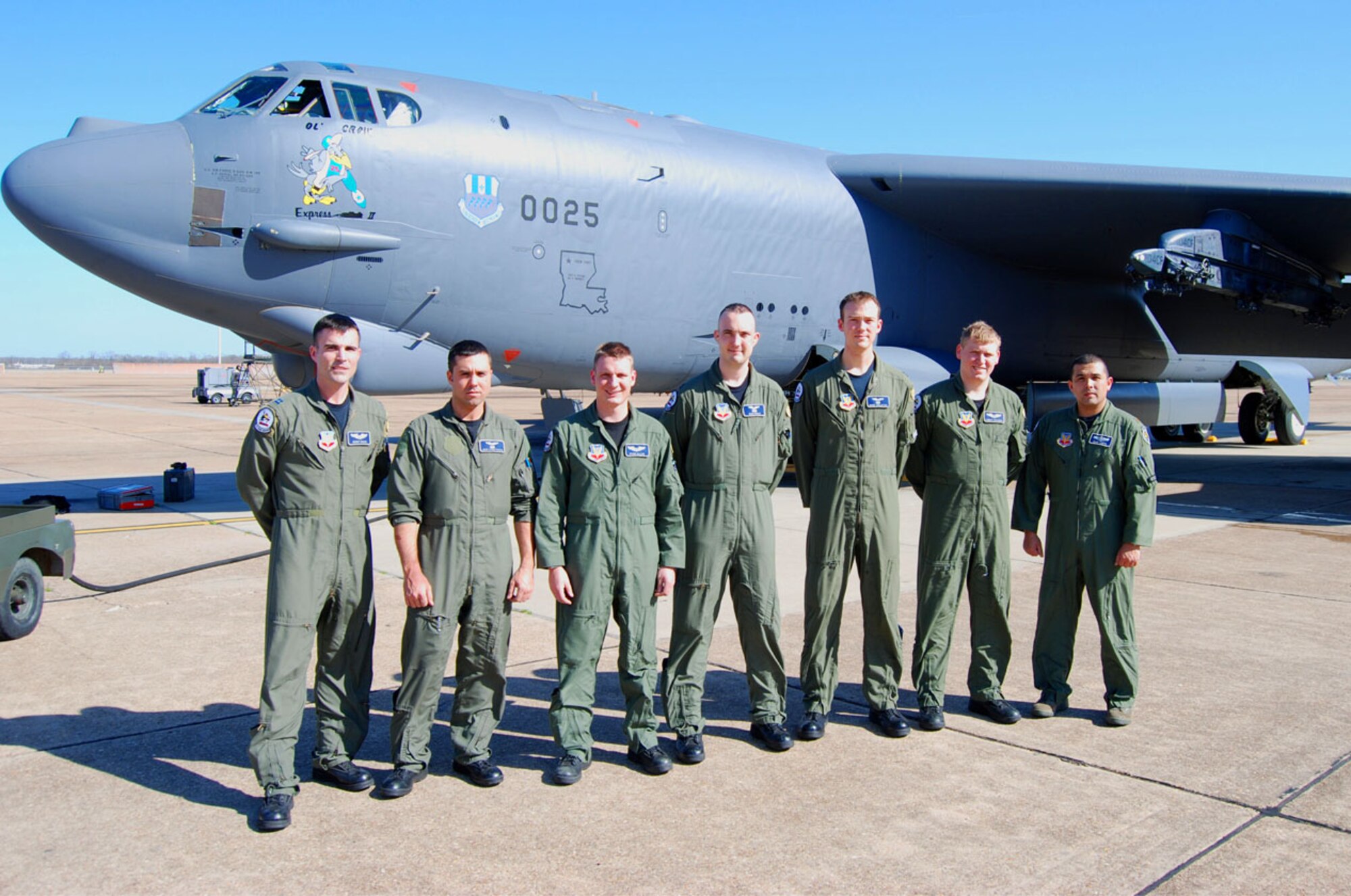 Members of the 20th Bomb Squadron gather in front of a B-52 before flying to Naval Air Station Corpus Christi, Texas, to conduct a B-52 flyover for the Pilot For a Day program Feb. 18. (Courtesy photo)