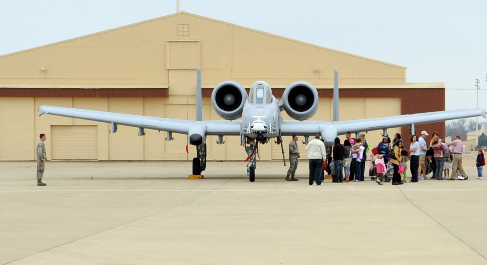 During Operation Hero, Feb. 28,  families visit a static display of an A-10 Warthog. (Airman 1st Class Brittany Y. Bateman/U.S. Air Force)