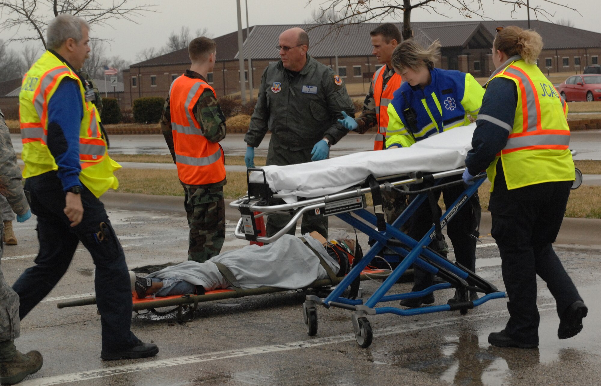 WHITEMAN AIR FORCE BASE, Mo. - Members of the 509th Medical group work with Members of the Johnson County Emergency services, perform medical treatments to victims during a Major Accident Response Exercise March 10. The MARE was conducted base-wide excluding Whiteman Elementary School and any personnel directly involved with flying operations.(U.S. Air Force photo/Senior Airman Cory Todd)