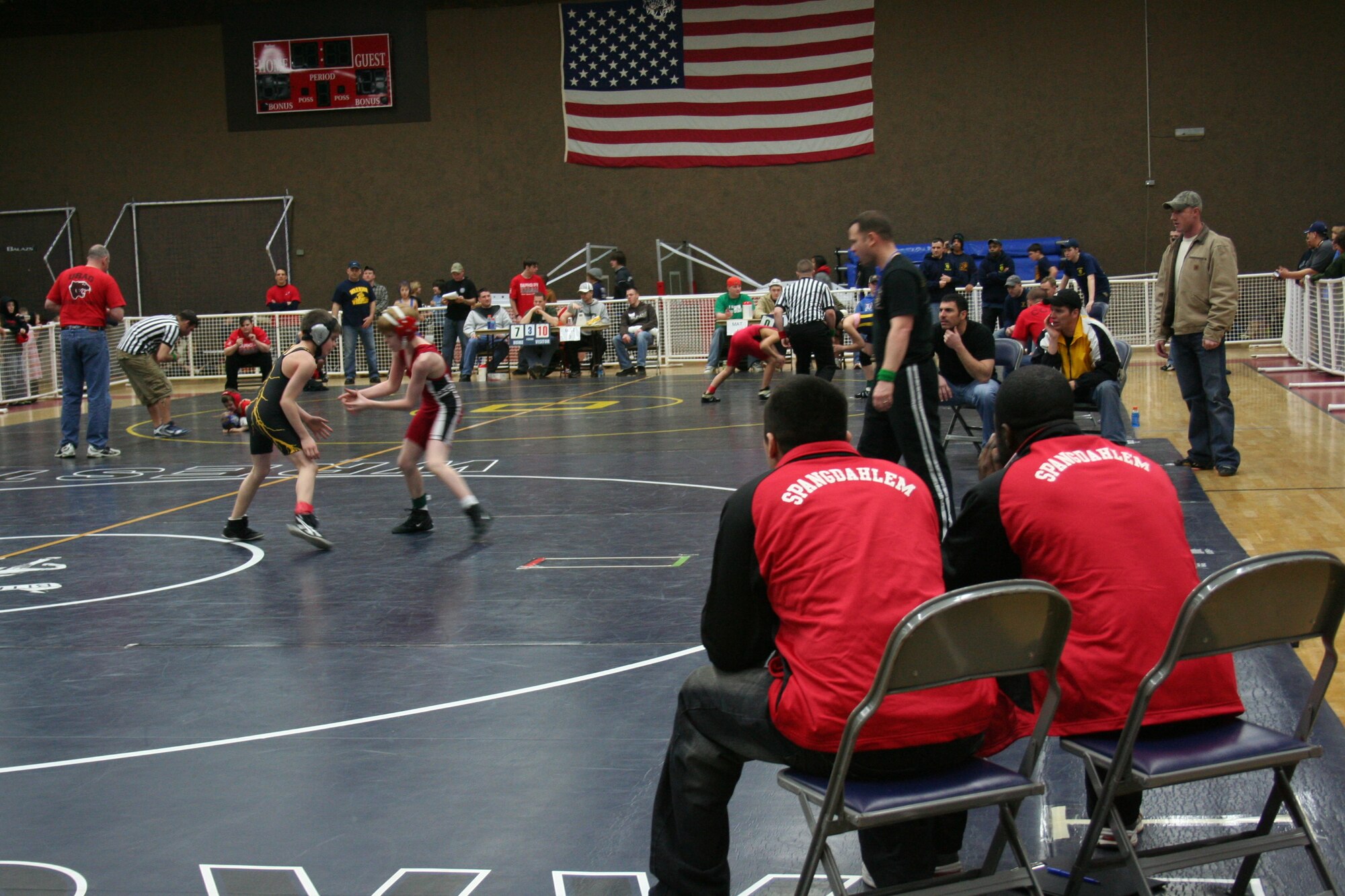 SPANGDAHLEM AIR BASE, Germany – The Spangdahlem team coaches, Efrain Huereque and Tony Hibbert, observe a match between Mike Baldinger, Stuttgart, and Tristan Korff, Spangdahlem, at the Skelton Memorial Fitness Center March 7, 2009.  Children, ages 5-18, from schools throughout U.S. Air Forces Europe competed in the tournament.  (Courtesy photo)  