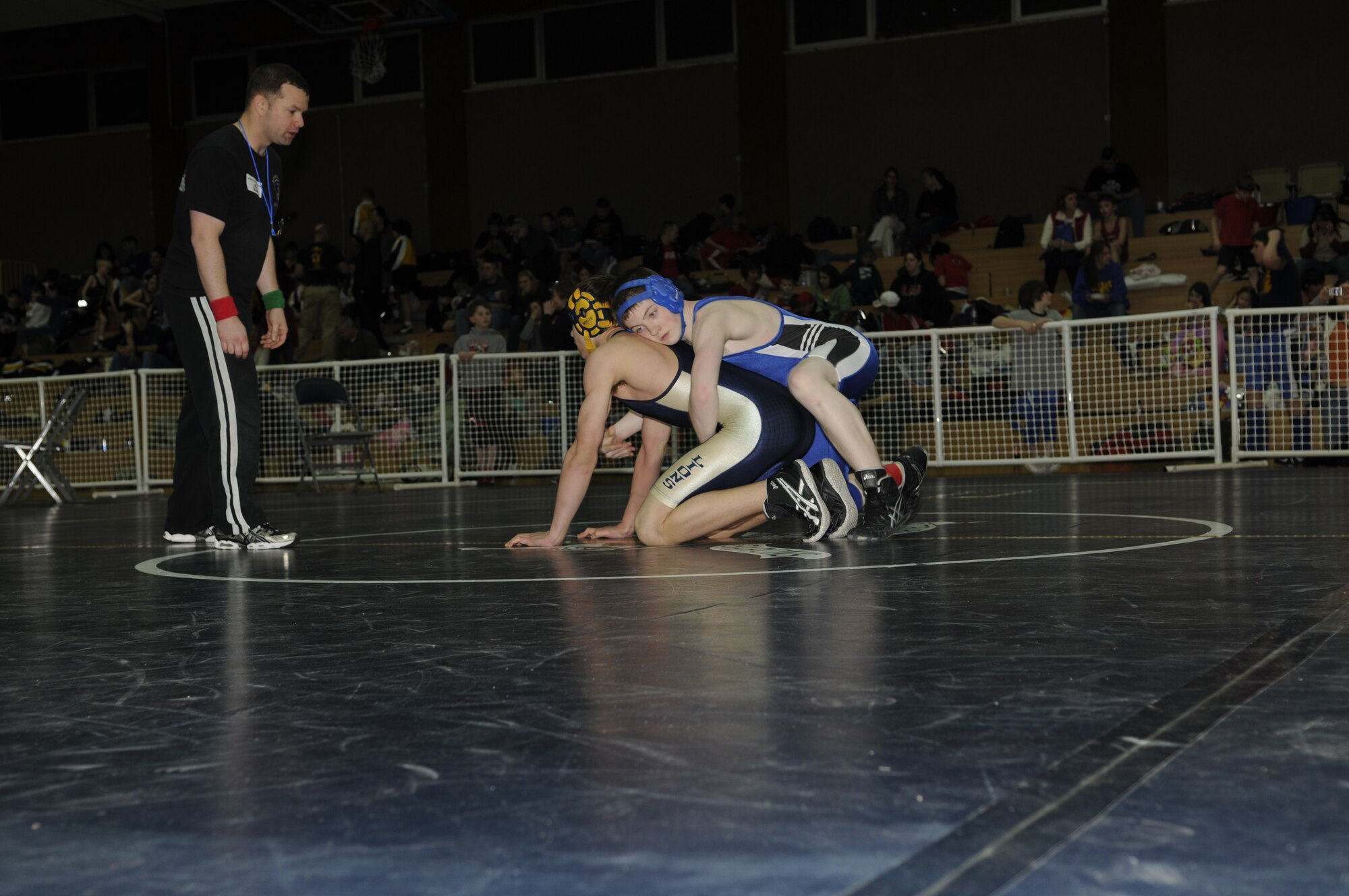 SPANGDAHLEM AIR BASE, Germany -- Competitors struggle during a match to gain advantageous positions March 7, 2009.  Children, ages 5-18, from schools throughout U.S. Air Forces Europe competed in the Spangdahlem Sabers Wrestling Tournament at the Skelton Memorial Fitness Center.  (U.S. Air Force photo by Senior Airman Allen Pollard)
