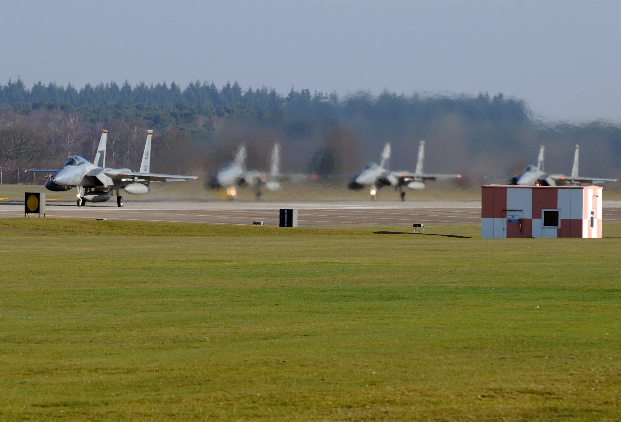 A 493rd Fighter Squadron F-15C Eagle throttles up for takeoff while departing RAF Lakenheath for Gando Air Base, Spain March 6, 2009. The aircraft took off in two waves to participate in a dissimilar air combat training exercise. The overarching goal of the exercise is to improve flying skills against other aircraft, to include the Eurofighter and F/A-18, and improve relations with the Spanish Air Force. (U.S. Air Force photo by Staff Sgt. Nathan Gallahan.)