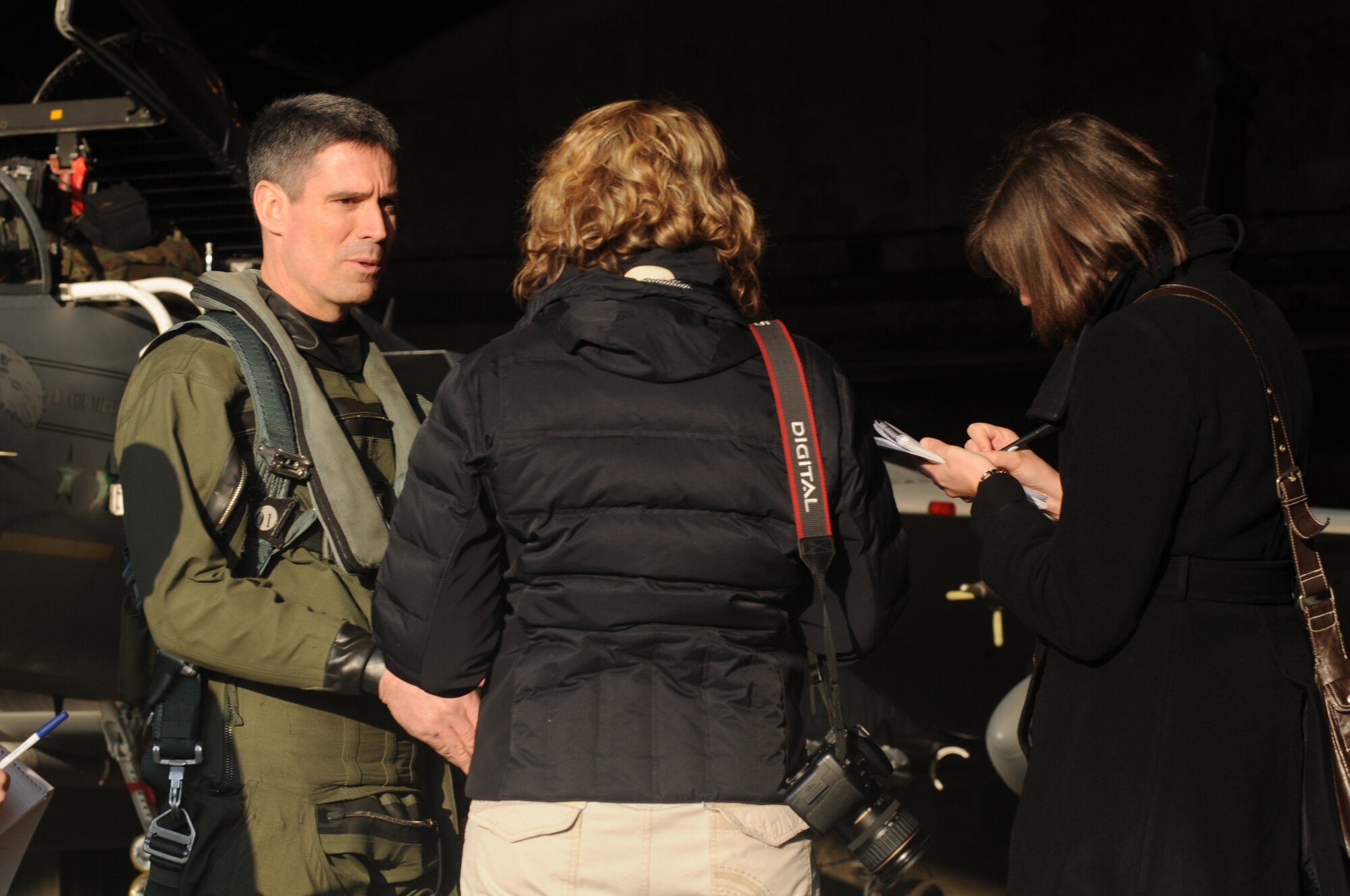 Lt. Col. Michael King, 493rd Fighter Squadron commander, answers questions from local reporters about his squadron’s participation in an exercise at Gando Air Base, Spain. The squadron will be participating in the two-week exercise to hone their skills against dissimilar aircraft, to include the Eurofighter and F/A-18s. (U.S. Air Force photo by Staff Sgt. Nathan Gallahan.)