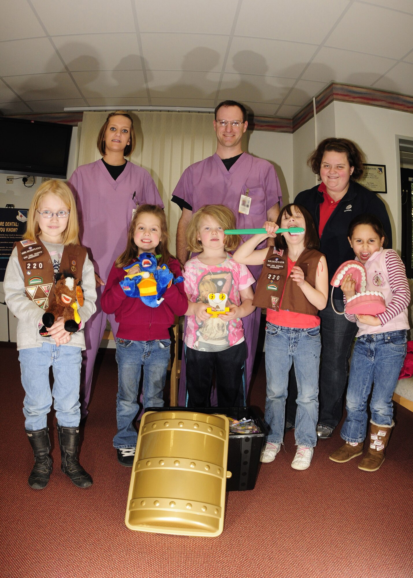 SPANGDAHLEM AIR BASE, Germany -- The Girl Scouts present $1000 of toys to the 52nd Medical Group’s Pediatric Dental Clinic March 3, 2009. The Girl Scouts raised the money through their cookie sale.  (U.S. Air Force photo by Airman First Class Nicholas Wilson)