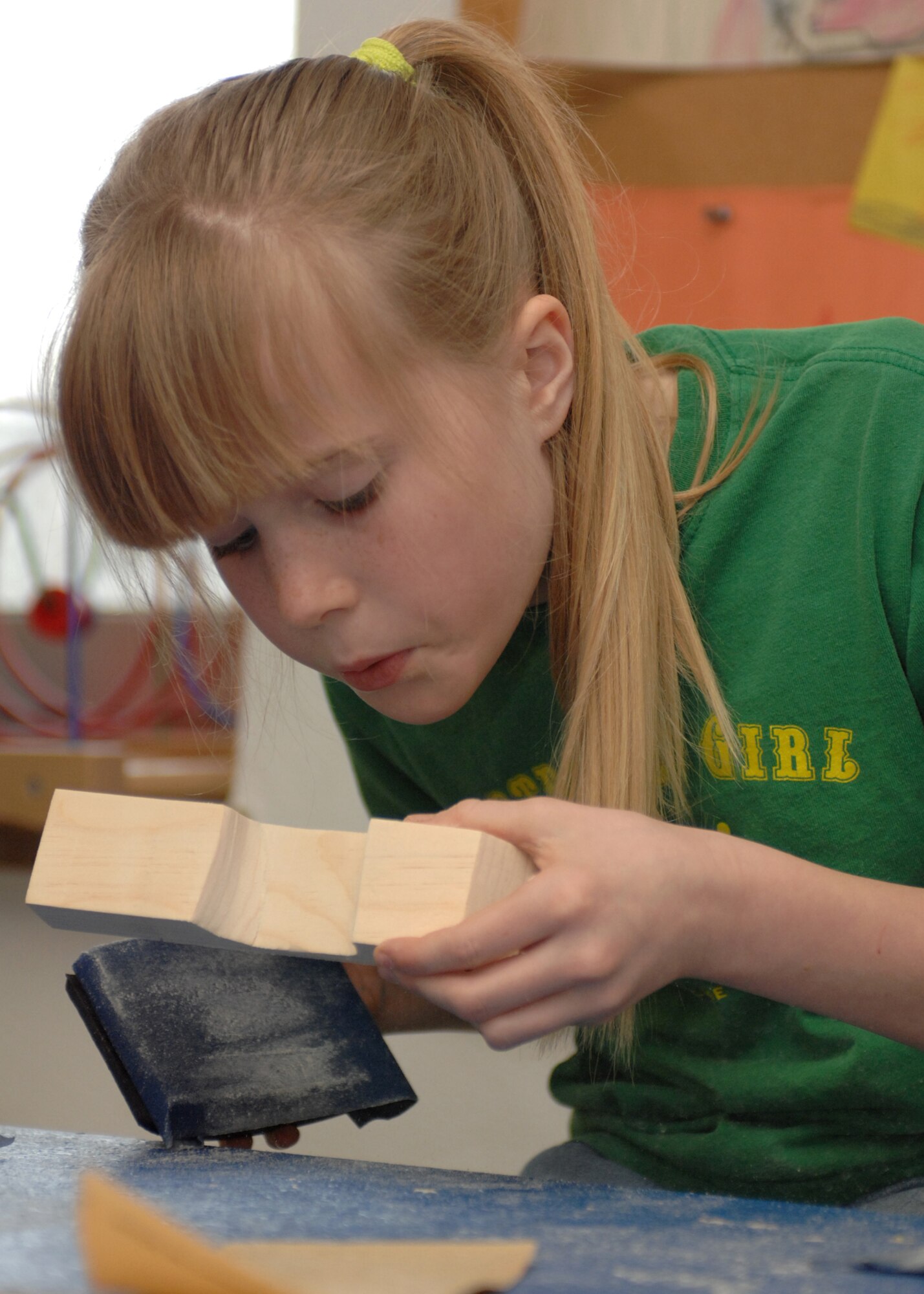 SPANGDAHELM AIR BASE, Germany --  Spangdahlem Girl Scouts design, cut, sand, paint, assemble and do final work on their Pinewood Derby cars Feb. 28, 2009.  The Spangdahlem Girl Scouts spent two days preparing their cars for the Pinewood Derby car race to be held March 21, 2009. (U.S. Air Force photo by Senior Airman Jenifer H. Calhoun)