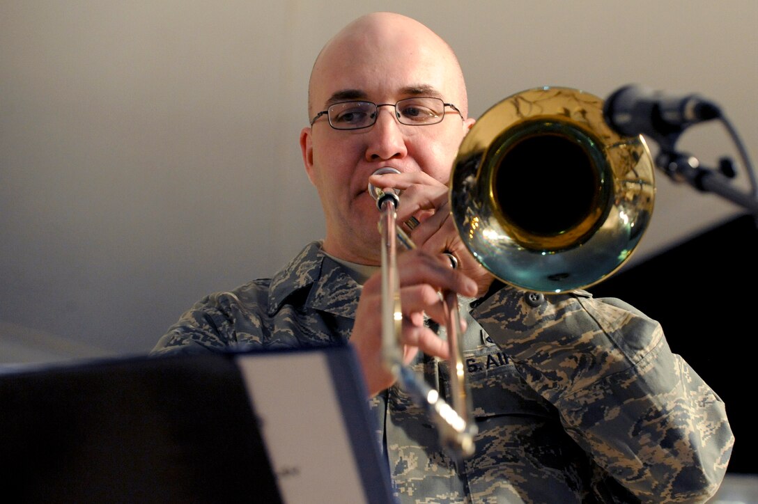Staff Sgt. Frank Gourley, a member of the AFCENT band Sirocco, plays the trombone during a performance, March 9, 2009, in an undisclosed location in Southwest Asia.  Sergeant Gourley and fellow band members travel throughout the U.S. Central Command's area of responsibility performing for deployed servicemembers.  Sergeant Gourley is native to Duluth, Minn. and is deployed from Sembach Air Base, Germany in support of Operations Iraqi and Enduring Freedom and Combined Joint Task - Horn of Africa.  (U.S. Air Force Photo by Staff Sgt. Joshua Garcia/released)