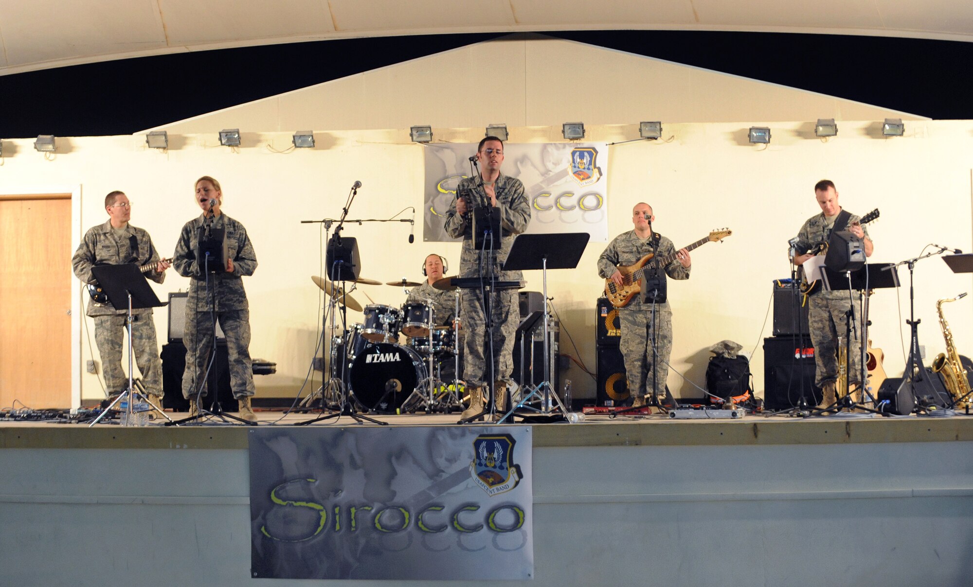 The AFCENT Band Sirocco, performs for servicemembers, March 9, 2009, in an undisclosed location in Southwest Asia.  The band is deployed from Sembach Air Base, Germany and travels throughout the U.S. Central Command's area of responsibility performing for deployed servicemembers, in support of Operations Iraqi and Enduring Freedom and Combined Joint Task Force - Horn of Africa.  (U.S. Air Force Photo by Staff Sgt. Joshua Garcia/released)  