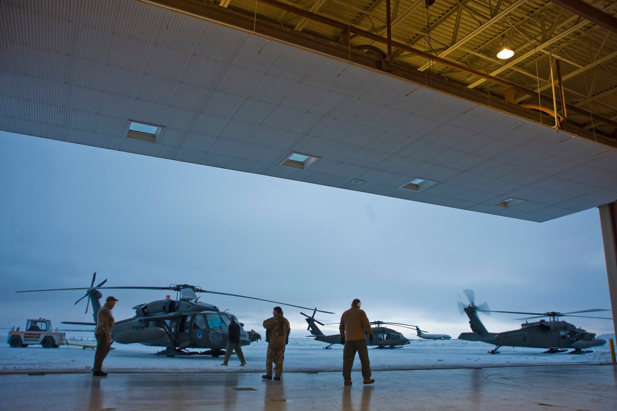 Soldiers from the Alaska Army National Guard's 1st 207 Aviation Regiment guide a Black Hawk onto the flight line in Bethel, Alaska, March 12, 2009. The 1st 207 Aviation Regiment is responsible for transporting all medical teams and supplies during Operation Arctic Care, a Navy-led readiness exercise providing no-cost health care to 14 villages in Western Alaska's Yukon-Kuskokwim region. (U.S. Air Force photo by Senior Airman Christopher Griffin)