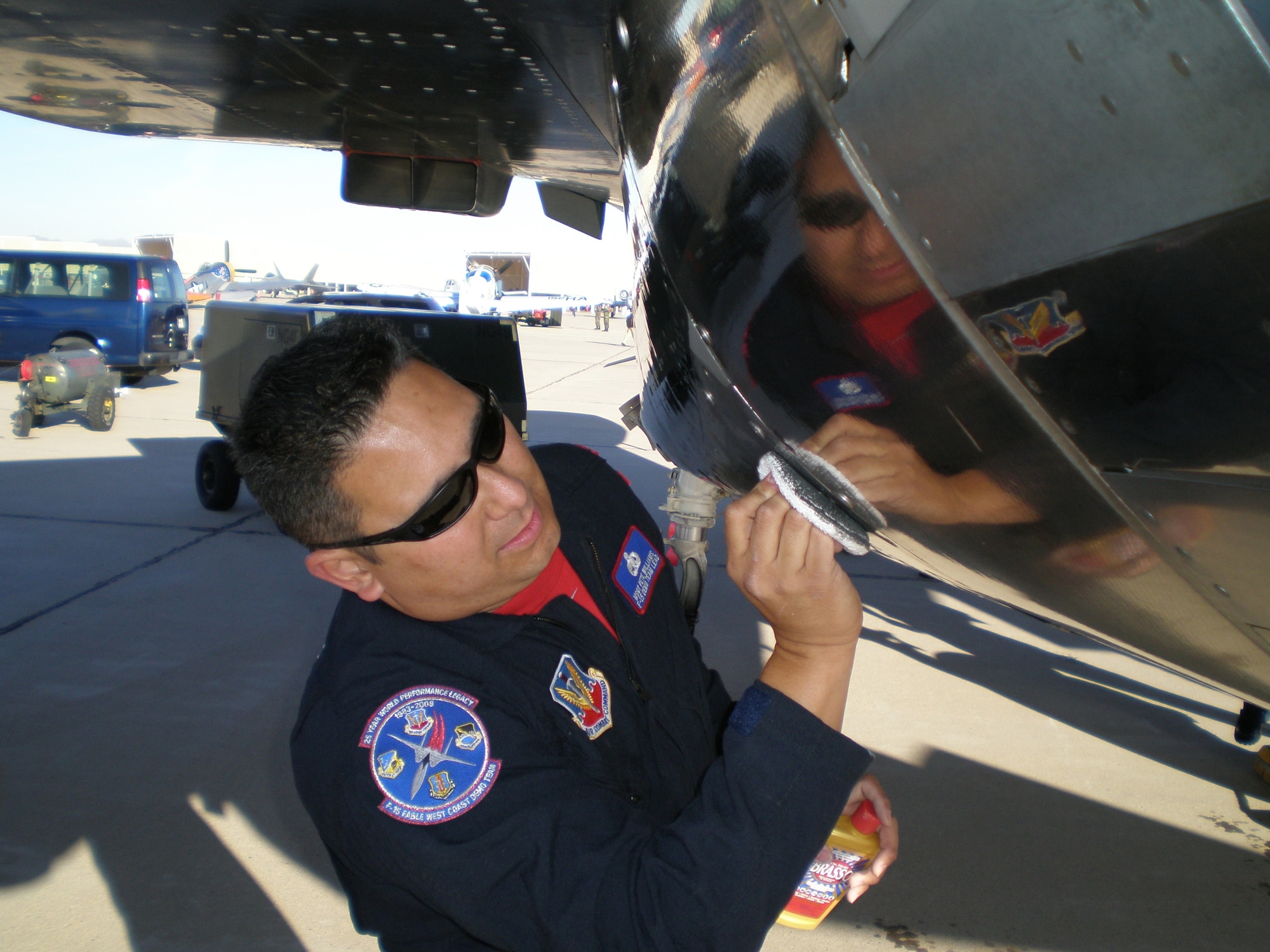 Master Sgt. Pete Williams, Air Combat Command F-15 West Coast Demo Team superintendent, polishes titanium engine bay panels on the team’s aircraft during the annual Heritage Flight Conference at Davis-Monthan Air Force Base, Ariz. (U.S. Air Force photo/Master Sgt. Bryan Jones)