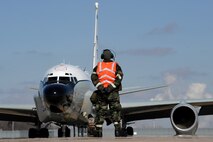 OFFUTT AIR FORCE BASE, Neb.-- Senior Airman Matt Schooveld, crew chief with the 38th Aircraft Maintenance Unit, prepares to marshall an RC-135V/W Rivet Joint reconnaissance aircraft, located on the lower parking ramp, Offutt AFB,  for takeoff as part of an Operational Readiness Exercise March 11. 55th Wing Airmen went through a thorough three day exercise to test their mission skills prior to deploying. The 55th wing is in preparation for an Operational Readiness Inspection Sept. 10-16. U.S. Air Force Photo by Josh Plueger