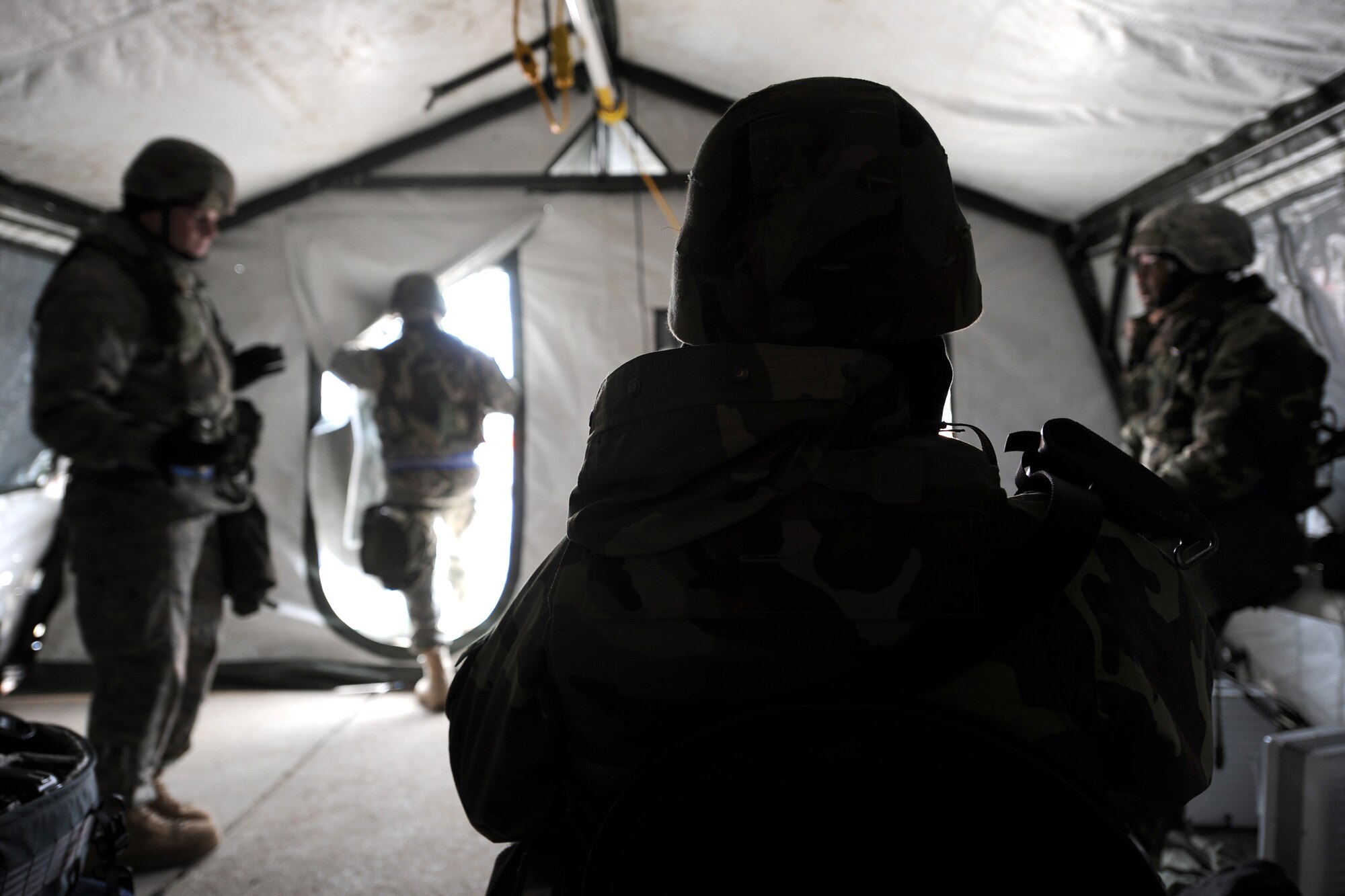 OFFUTT AIR FORCE BASE, Neb. -- Airmen assigned to the 55th Security Forces Squadron rotate from blustering winds into the heated Echo 1 entry control point tent while participating in an Operational Readiness Exercise March 10. The wing will be conducting exercises in preparation for an Operational Readiness Inspection Sept. 10-16. 
 U.S. Air Force Photo by Josh Plueger
(CLEARED)
