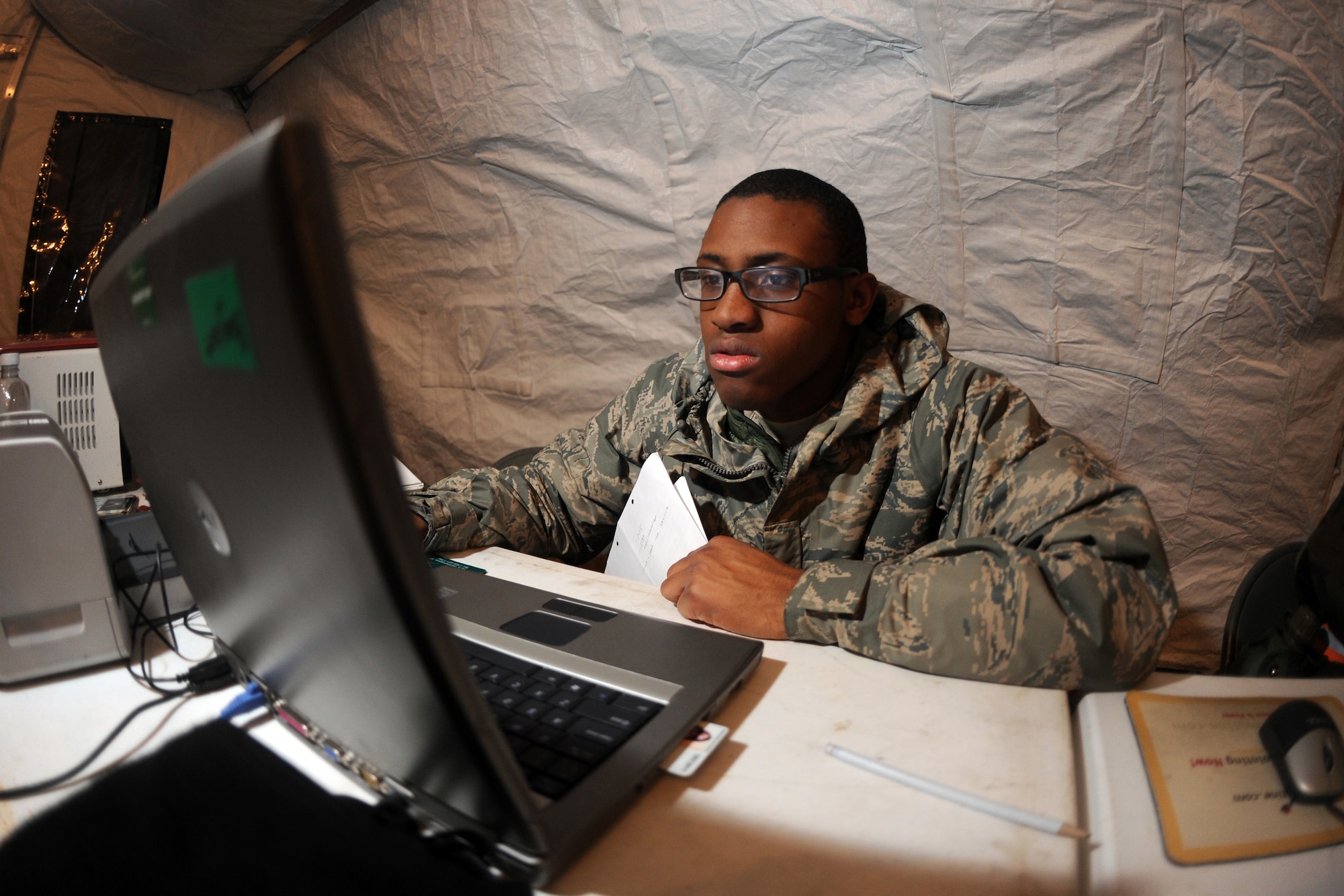 OFFUTT AIR FORCE BASE, Neb. -- A1C Malcom Williams, a force management personnelist with the 55th Force Support Squadron, reports the current casualty report to the Air Force Personnel Center while participating in an Operational Readiness Exercise March 10, 2009. 55th Wing Airmen went through a thorough three day exercise to test their mission skills prior to deploying. The 55th wing is in preparation for an Operational Readiness Inspection Sept. 10-16.

 U.S. Air Force Photo by Josh Plueger
(CLEARED)
