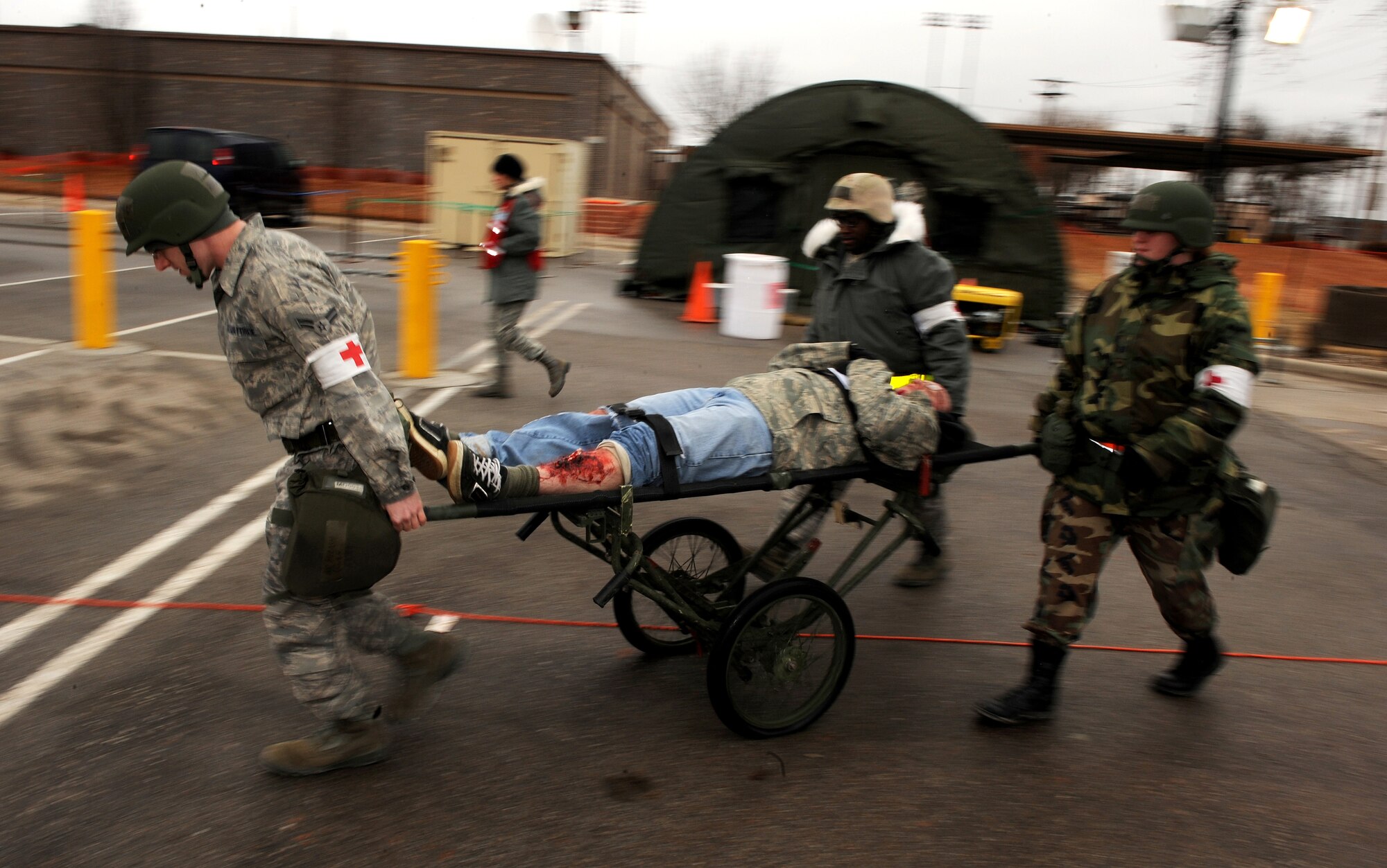 OFFUTT AIR FORCE BASE, Neb. --  Airman with the 55th Medical Group transport victims of a mock ground attack near base "x" as part of an Operational Readiness Exercise Mar. 10. 55th Wing Airmen went through a thorough three day exercise to test their mission skills prior to deploying. The wing will be conducting exercises in preparation for an Operational Readiness Inspection Sept. 10-16. 

 U.S. Air Force Photo by Josh Plueger
(CLEARED)