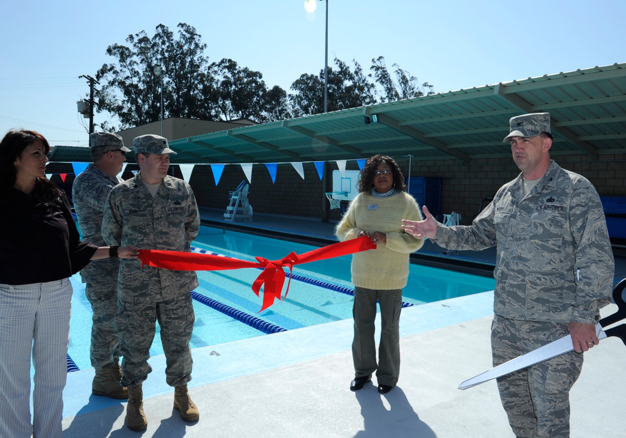 VANDENBERG AIR FORCE BASE, Calif. -- Col. Steven Wright, the 30th Mission Support Group commander, expresses his thanks and appreciation to the people involved with the upgrades to the base pool at its official re-opening ribbon-cutting ceremony here March 12.  The more than 50 year-old pool was vandalized in August, 2008 and closed for cleaning.  The pool received nearly $750,000 in upgrades after it was discovered that various pipes were leaking and causing massive looses in money per year.  The upgrades are projected to save Vandenberg more than $100,000 per year.  (U.S. Air Force photo/Senior Airman Stephanie Longoria)