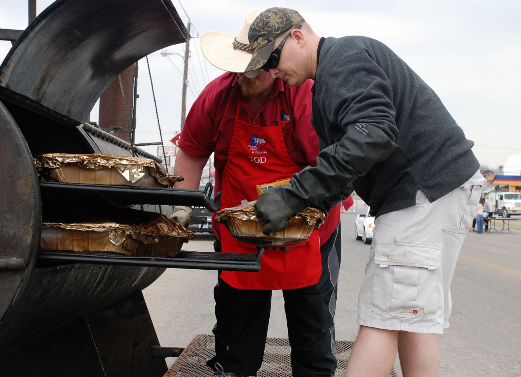 LAUGHLIN AIR FORCE BASE, Texas – Volunteers from the 47th Flying Training Wing and Del Rio work together to cook brisket and beans to pass out to the Del Rio community during a fundraising event in Del Rio March 7. The fundraiser was sponsored by the Del Rio Chamber of Commerce Military Affairs Association to help raise money for Laughlin’s upcoming Dining Out. (U.S. Air Force photo by Tech Sgt. Joel Langton)