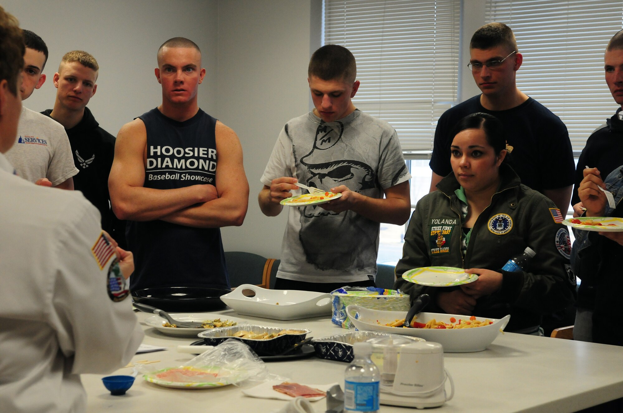 Bolling Airmen enjoy a food sampling provided during a cooking demonstration at the new Air Force Honor Guard kitchen facility March 12. The cooks demonstrated basic food handling and preparation techniques to show Airmen healthy alternatives to fast food.