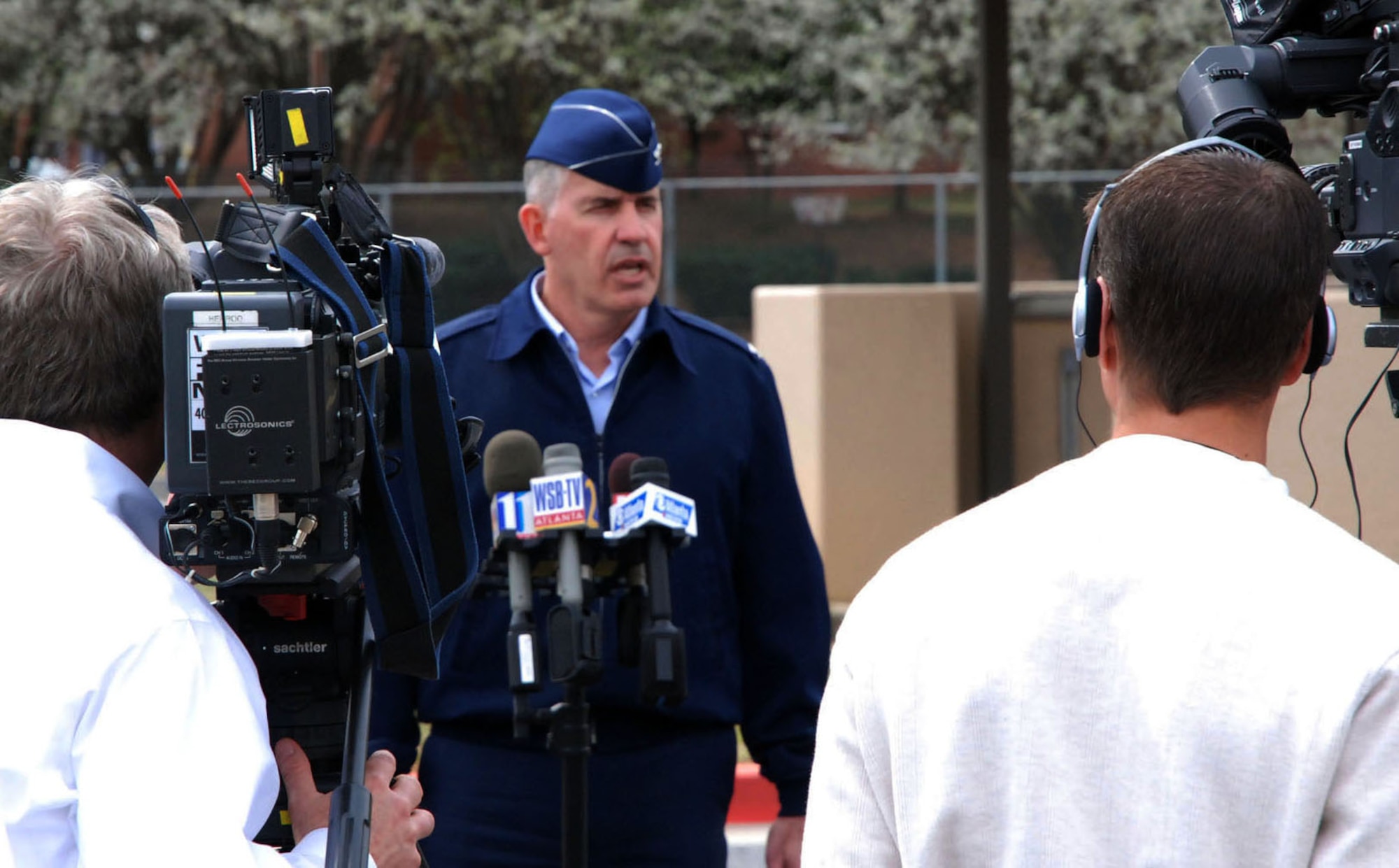 Col. Steven H. Slick, 94th Mission Support Group commander, speaks to Atlanta media about the joint response by the City of Marietta and Dobbins Air Reserve Base, Ga., to a bomb threat near the base's main gate March 11, 2009.  (U.S. Air Force photo/Tech. Sgt. James Branch)