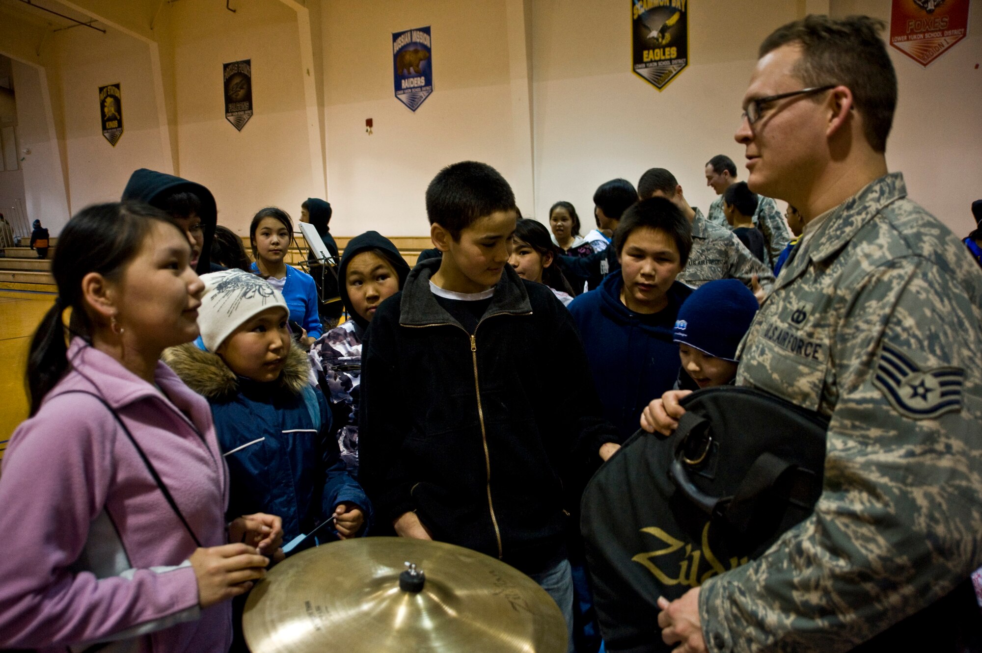 Staff Sgt. Troy Griffin of the U.S. Air Force Band of the Pacific's Alaska Brass speaks with schoolchildren after a performance at Ignatius Beans Sr. School in Mountain Village, Alaska, on March 11, 2009. The concert of the five-piece brass and percussion ensemble was part of Operation Arctic Care, a Navy-led medical readiness exercise providing no-cost health care and veterinary support to 12 villages in Western Alaska.  (U.S. Air Force photo by Senior Airman Christopher Griffin) 