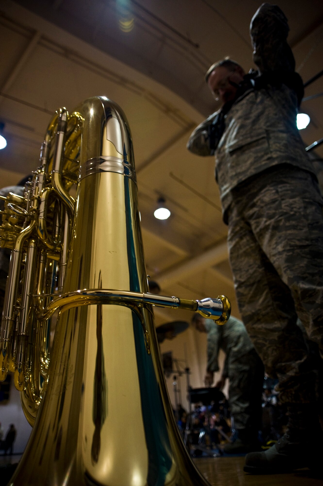 Tech. Sgt. Bill Granger of the U.S. Air Force Band of the Pacific's Alaska Brass straps on his tuba harness to play for students at Ignatius Beans Sr. School in Mountain Village, Alaska, March 11, 2009. The concert of the five-piece brass and percussion ensemble was part of Operation Arctic Care, a Navy-led medical readiness exercise providing no-cost health care and veterinary support to 12 villages in Western Alaska. (U.S. Air Force photo by Senior Airman Christopher Griffin)