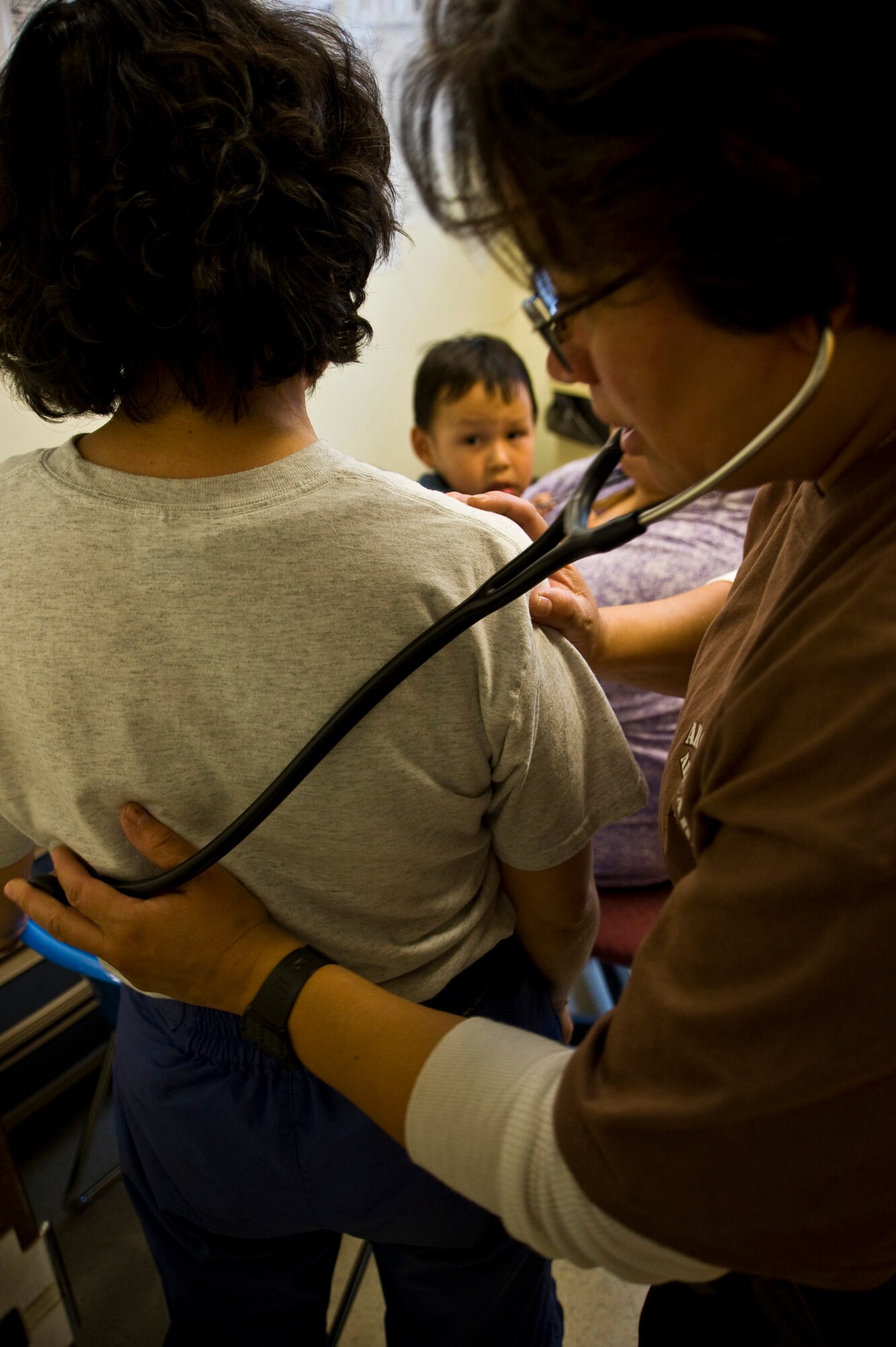 Navy Cmdr. Nancy Moya of Pueblo, Colo., attached to Operational Health Support Unit Bremerton Detachment P, checks Carole Alexie's heartbeat during a health physical in Mountain Village, Alaska, on March 11, 2009. A joint military medical team is deployed to Mountain Village in support of Operation Arctic Care. This year's Navy-led mission has teams in 14 villages in Alaska's Yukon-Kuskokwim Delta region providing medical, dental and veterinary support at no cost to Alaskan natives. (U.S. Air Force photo by Senior Airman Christopher Griffin)