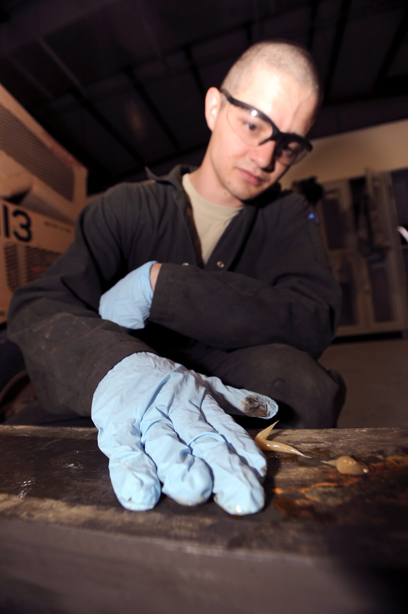 Senior Airman James Ashburn, an Aircraft Ground Equipment mechanic with the 379th Expeditionary Maintenance Squadron, applies lubricant to a B-1B Lancer bomb lift during its annual inspection, March 10, 2009, in an undisclosed location in Southwest Asia.  The annual inspection uses preventative maintenance and observation of functions to ensure continued operation with minimal unscheduled down-time.  Airman Ashburn is native to Glennville, Ga. and is deployed from Elmendorf Air Force Base, Alaska in support of Operations Iraqi and Enduring Freedom and Combined Joint Task Force - Horn of Africa.  (U.S. Air Force Photo by Staff Sgt. Joshua Garcia/released)