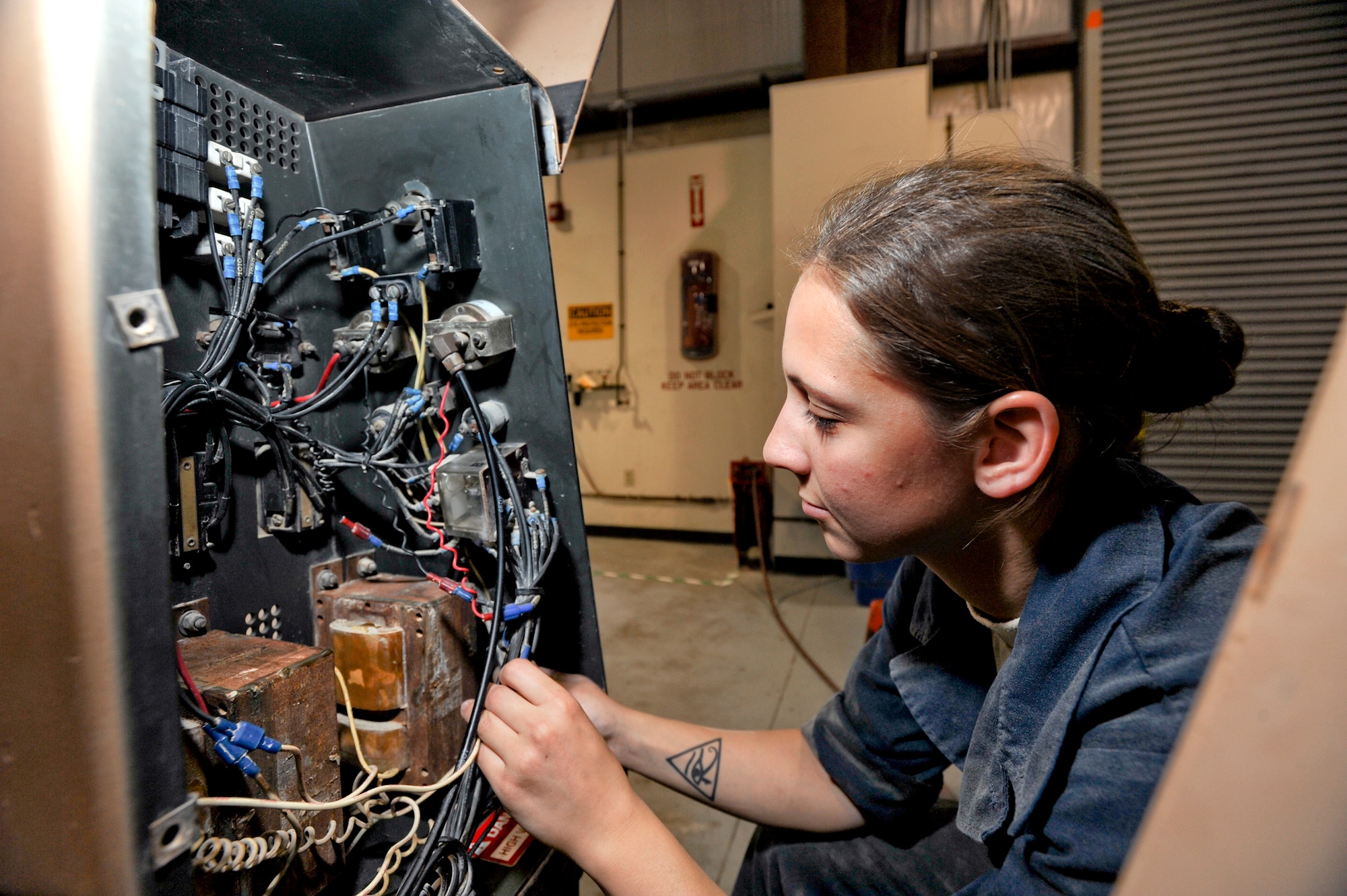 Senior Airman Shantelle George, an Aircraft Ground Equipment mechanic with the 379th Expeditionary Maintenance Squadron, performs a Phase II annual inspection on a Light All cart, March 10, 2009, in an undisclosed location in Southwest Asia.  The Light All cart is a self-contained lighting system used to light up areas around an aircraft so maintainers can do the required work at night. Airman George is native to Lafayette, La. and is deployed from Aviano Air Base, Italy in support of Operations Iraqi and Enduring Freedom and Combined Joint Task Force - Horn of Africa.  (U.S. Air Force Photo by Staff Sgt. Joshua Garcia/released)