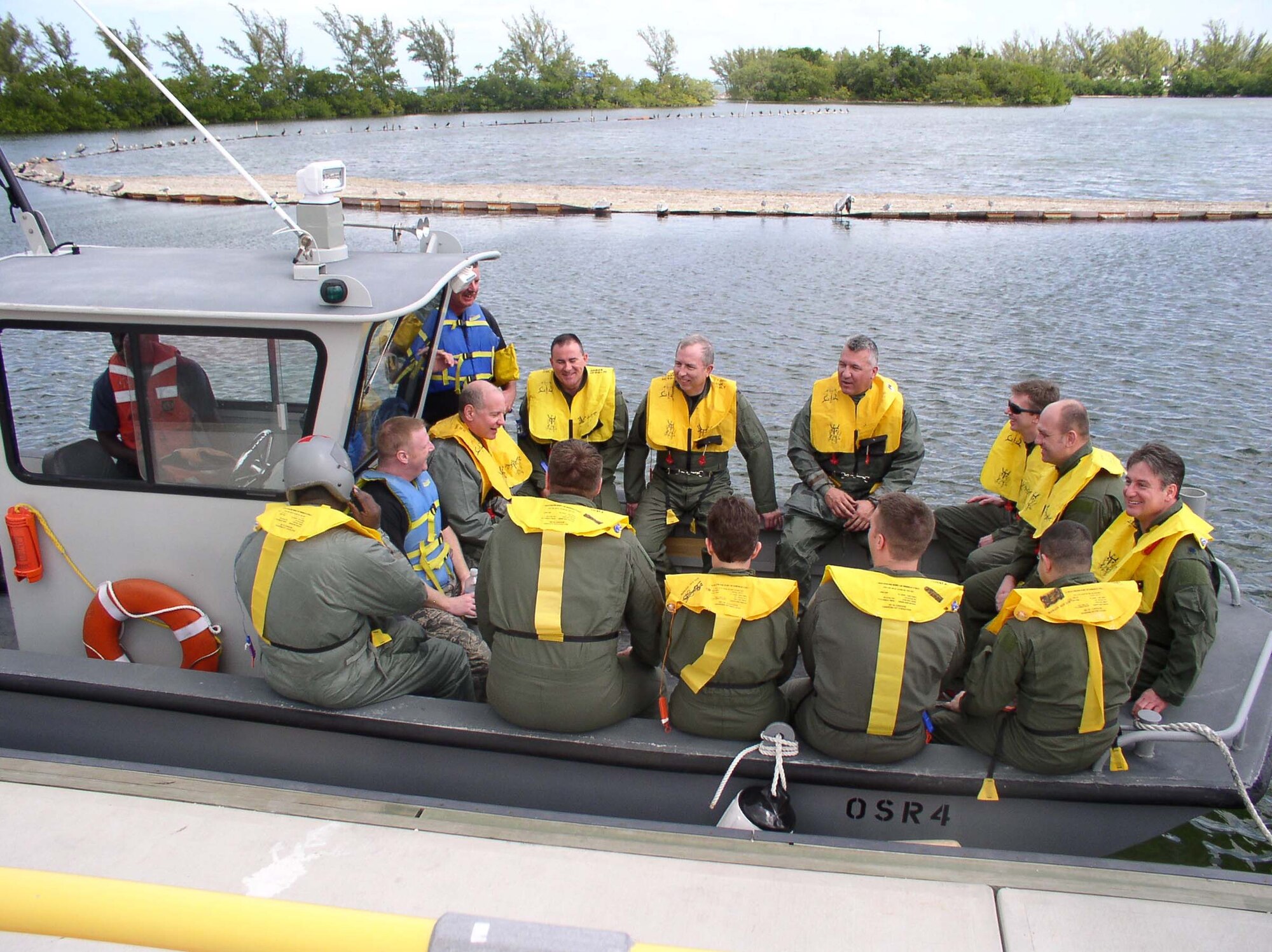 WRIGHT-PATTERSON AFB, Ohio – Members from the wing head out by boat to practice what they learned in water survival class . The Navy offered their services by providing the boats and personnel to take the airmen out into the water. (Air Force photo/Lt. Col. Jim Couzins) 