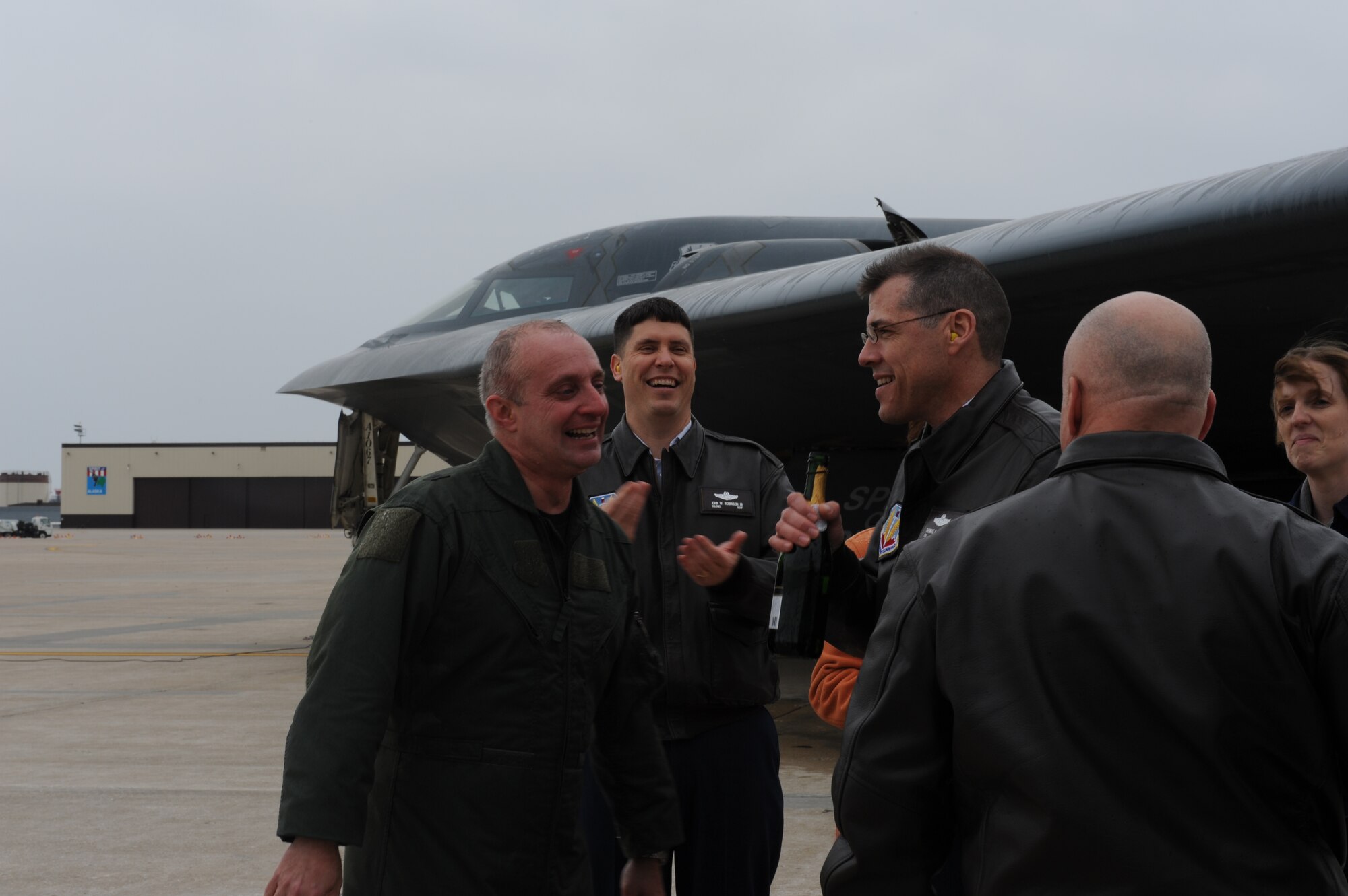WHITEMAN AIR FORCE BASE, Mo. - Brig. Gen. Garrett Harencak (left), 509th Bomb Wing commander, is met by several members of Wing leadership following his end-of-tour B-2 flight March 9. General Harencak will pass command of the 509th Bomb Wing to Col. Robert Wheeler, 2d Bomb Wing commander Barksdale AFB, La., during a change-of-command ceremony March 26. (U.S. Air Force photo/Staff Sgt. Charles Larkin)