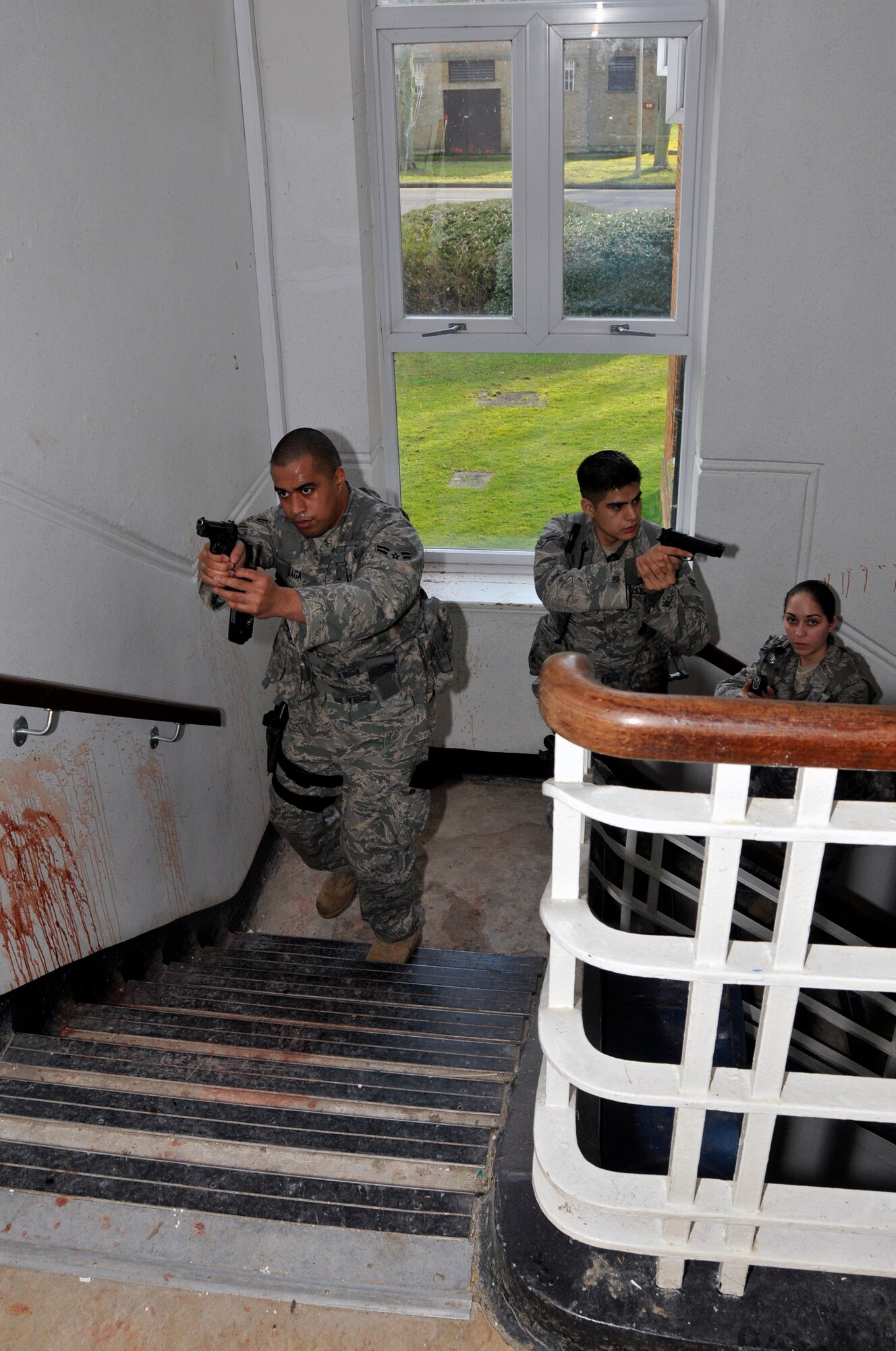 Airmen from the 48th Security Forces Squadron search for any more possible suspects or children March 4, 2009 at RAF Feltwell, England. The Airmen are participating in an "Active Shooter" scenario which teaches security forces Airmen how to handle a school shooting. (U.S. Air Force photo by Airman 1st Class Perry Aston) (Released)