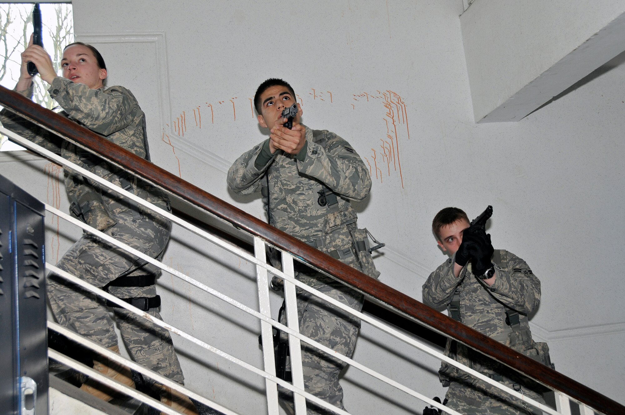 Airmen from the 48th Security Forces Squadron search for a simulated gunman that has barricaded himself inside an elementary school March 4, 2009 at RAF Feltwell, England. The Airmen are participating in an "Active Shooter" scenario which teaches security forces Airmen how to handle a school shooting. (U.S. Air Force photo by Airman 1st Class Perry Aston)