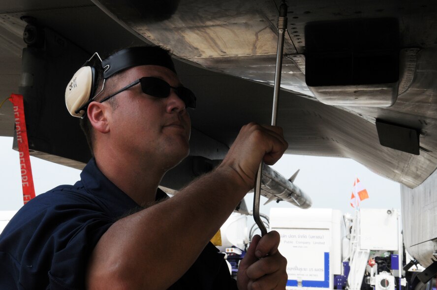 Tech. Sgt.Chad Heyen, from the 18th Aircraft Maintenance Squadron, Kadena Air Base, Japan, conducts a post-flight check on a deployed F-15 from the 44th Fighter Squadron at Korat Royal Air Force Base, Thailand, during Cope Tiger 2009 March 10. The 18th Wing is participating in Cope Tiger 2009, an annual exercise to improve combat readiness and interoperability of U.S., Thai and Singaporean forces while enhancing regional security and providing humanitarian support. (U.S. Air Force photo/Staff Sgt. Angelique Perez)
