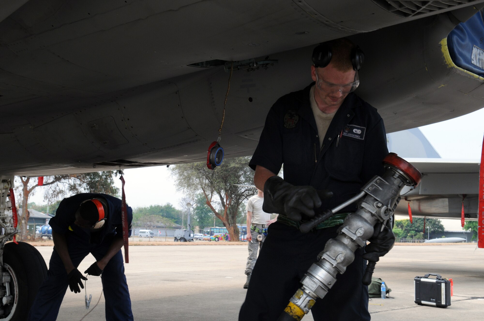 U.S. Air Force Senior Airman Collin Urbanowicz, from the 18th Aircraft Maintenance Squadron, Kadena Air Base, Japan, refuels one of Kadena's F-15's on the flight line at Korat Royal Air Force Base, Thailand during Cope Tiger 2009 on March 10.

Cope Tiger 2009 is an annual exercise to improve combat readiness and combined and joint interoperability of U.S., Thai and Singaporean forces while enhancing regional security and providing humanitarian support.
(U.S. Air Force Photo/Staff Sgt. Angelique Perez) 