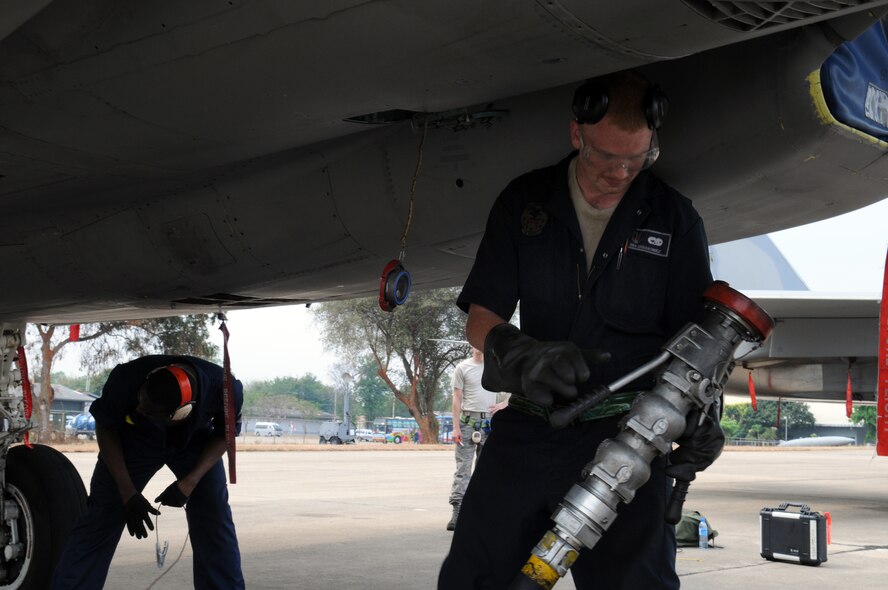 Senior Airman Collin Urbanowicz, from the 18th Aircraft Maintenance Squadron, Kadena Air Base, Japan, refuels a deployed F-15 from the 44th Fighter Squadron March 10 at Korat Royal Air Force Base, Thailand, during Cope Tiger 2009. The 18th Wing is participating in Cope Tiger 2009, an annual exercise to improve combat readiness and interoperability of U.S., Thai and Singaporean forces while enhancing regional security and providing humanitarian support. (U.S. Air Force photo/Staff Sgt. Angelique Perez)
